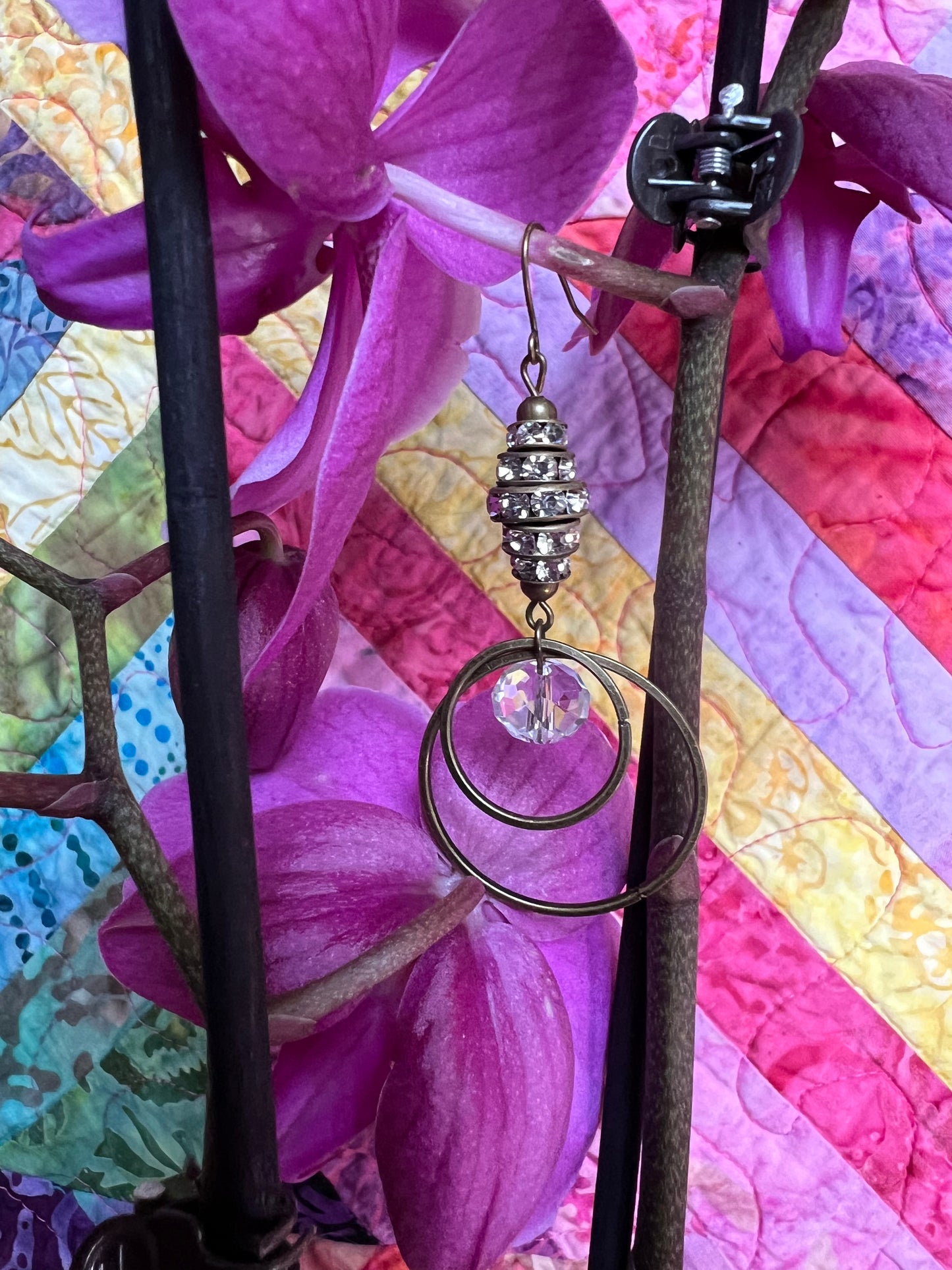 Earrings- Antique gold plated metal with clear crystals.