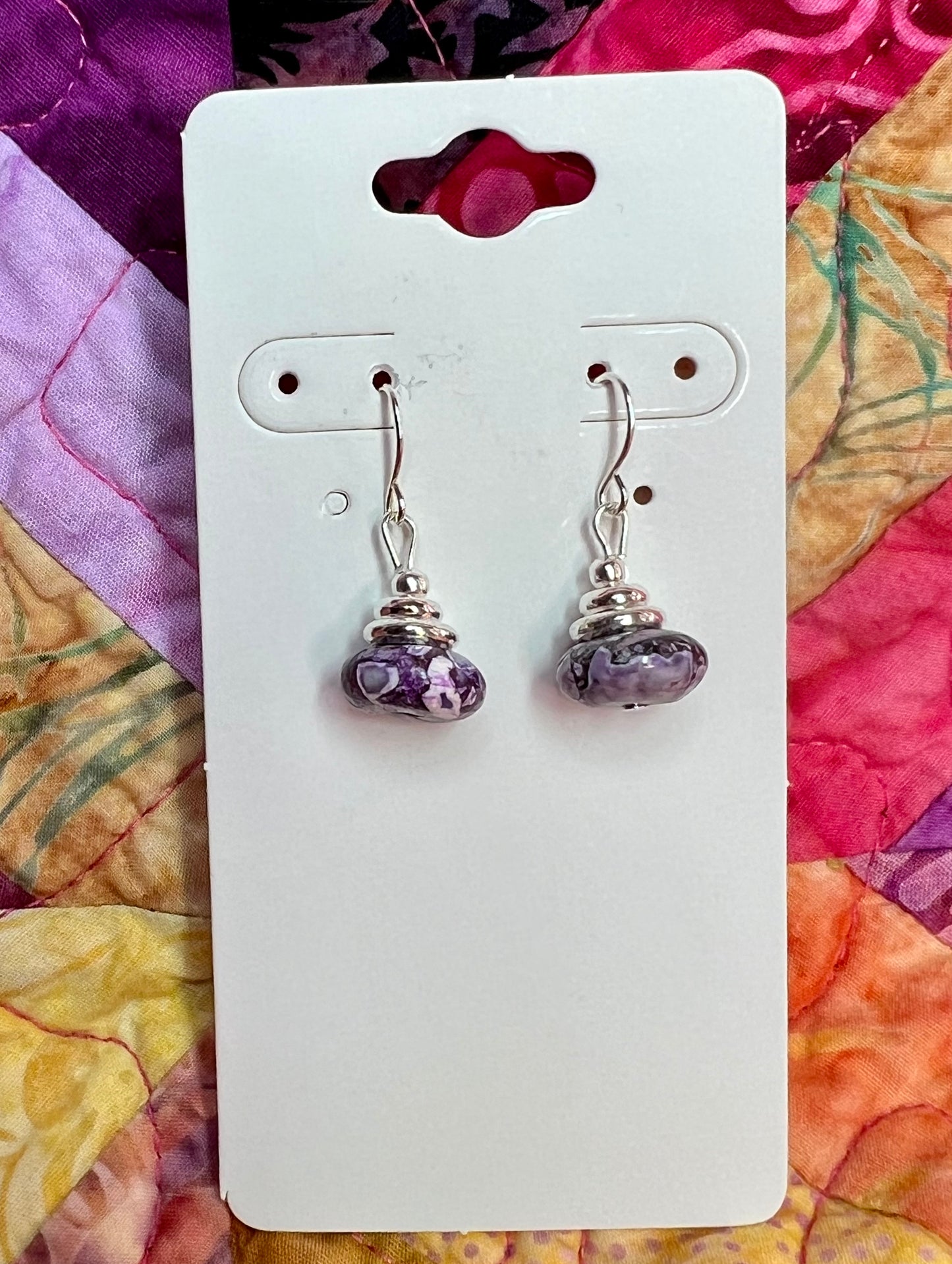 Earrings- Silver plated metal with purple dyed stone.