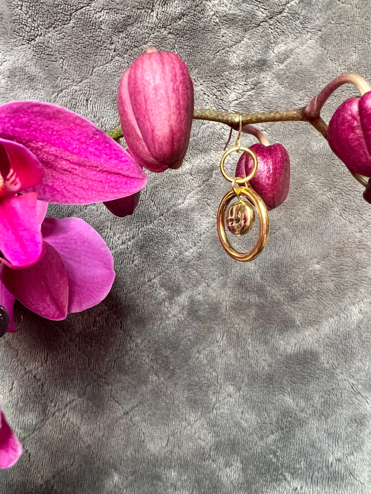 Earrings- Antiqued gold plated metal, hoops and coin shaped bead.