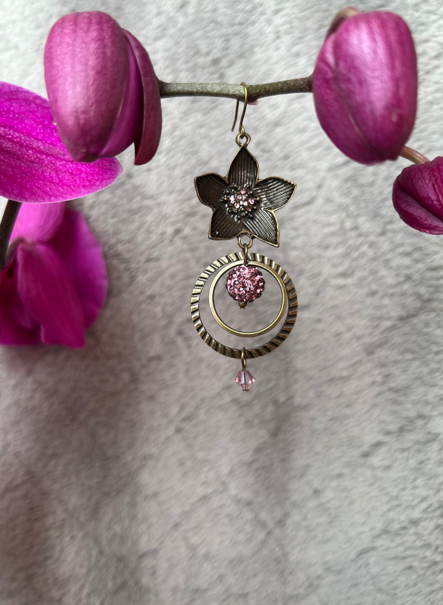 Earrings- Antique gold plated metal with purple crystals.