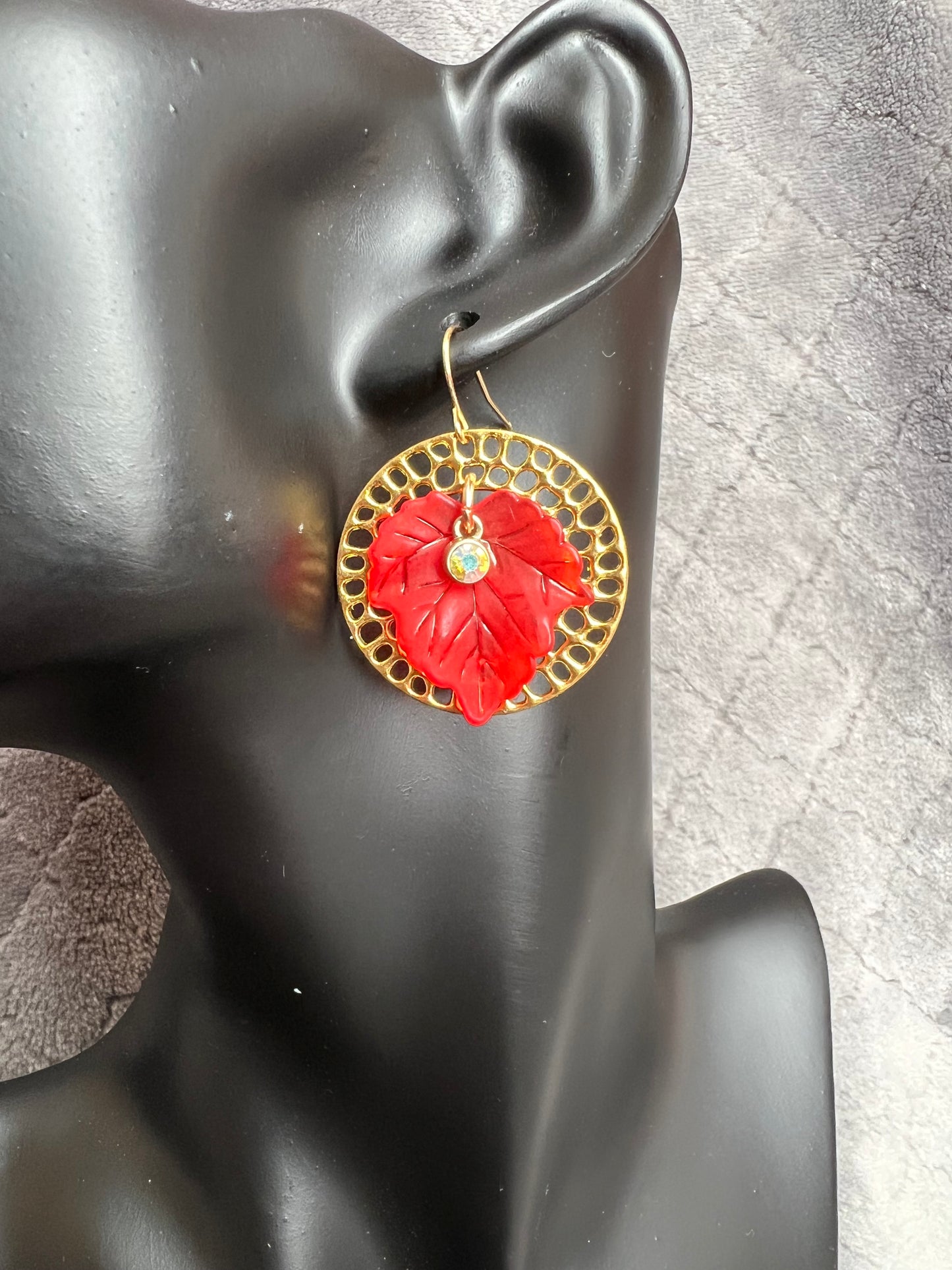 Earrings- Acrylic orange and red leaves with gold plated metal circle hoops and AB crystals.