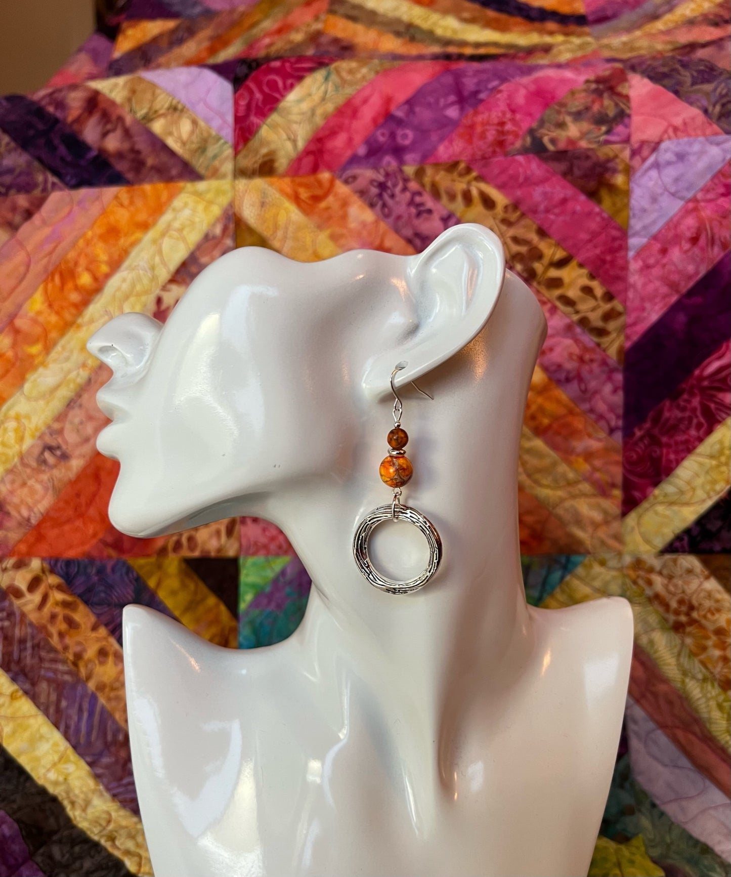 Earrings- Silver plated metal with beautiful orange beads.