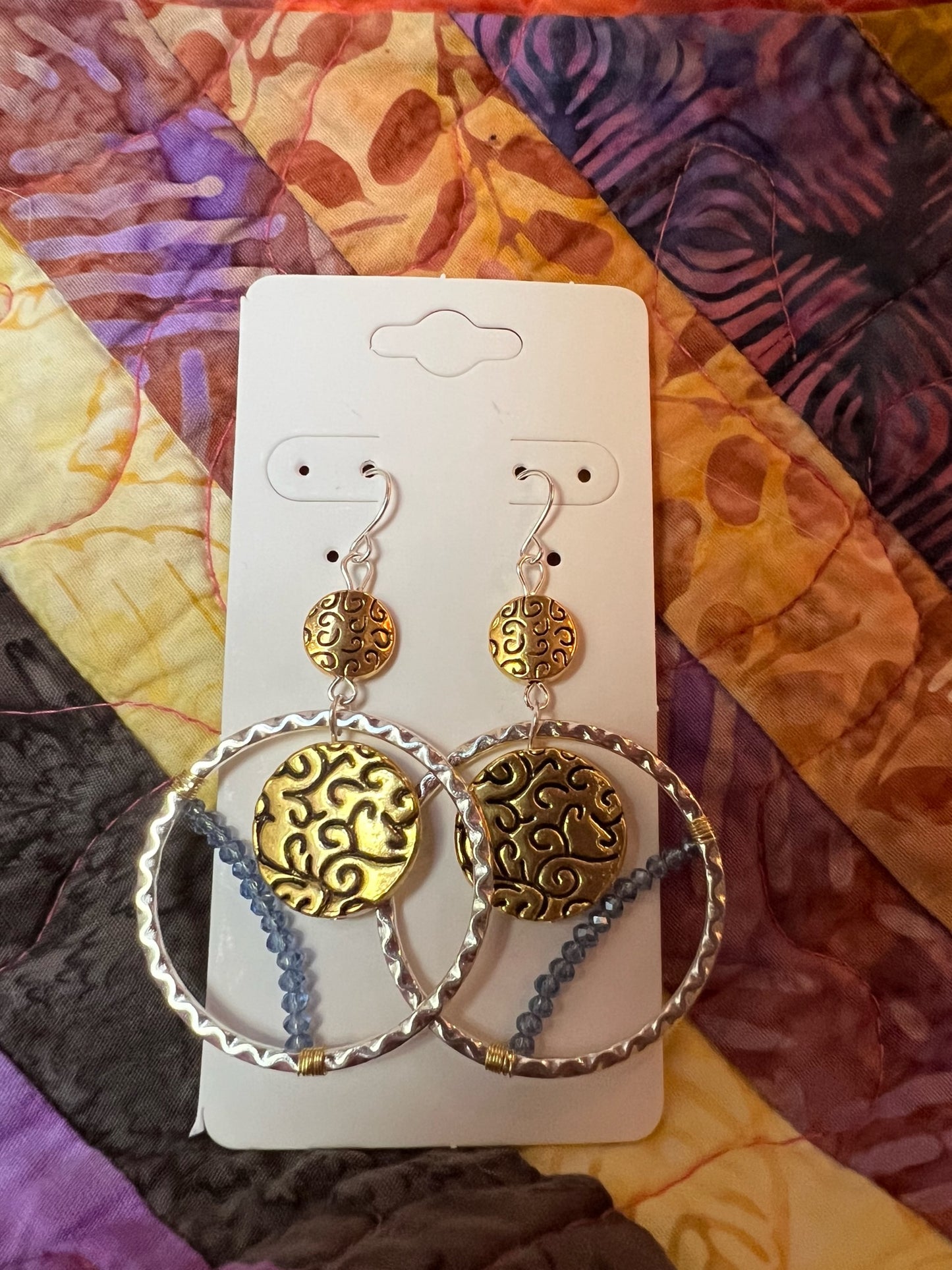 Earrings- Silver and gold plated metal with blue crystals.