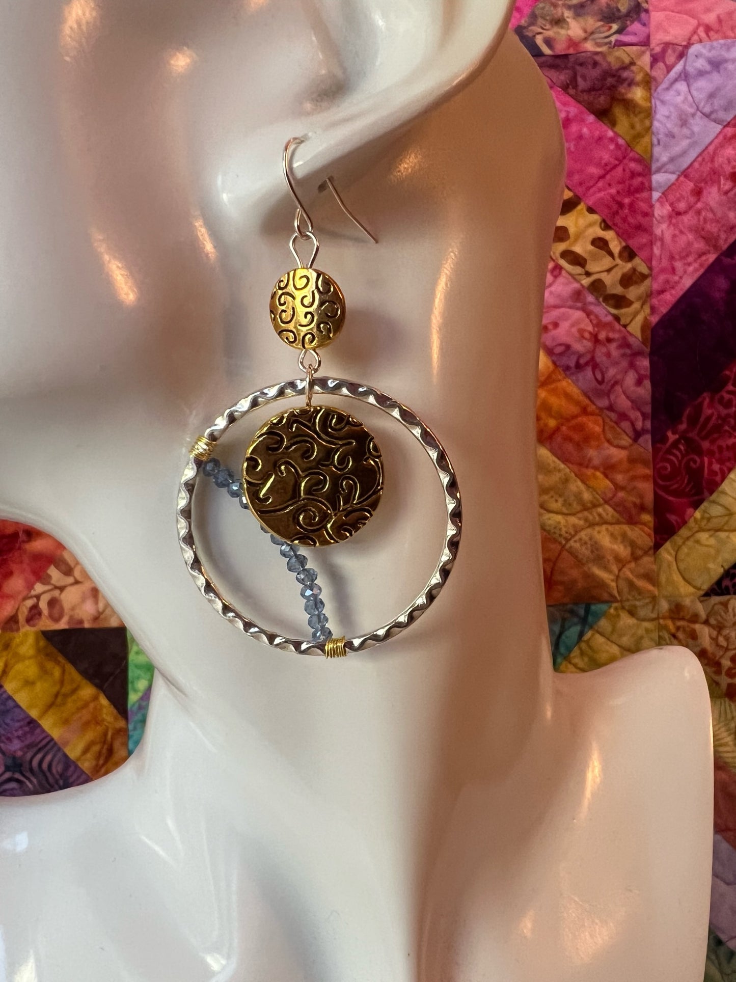 Earrings- Silver and gold plated metal with blue crystals.