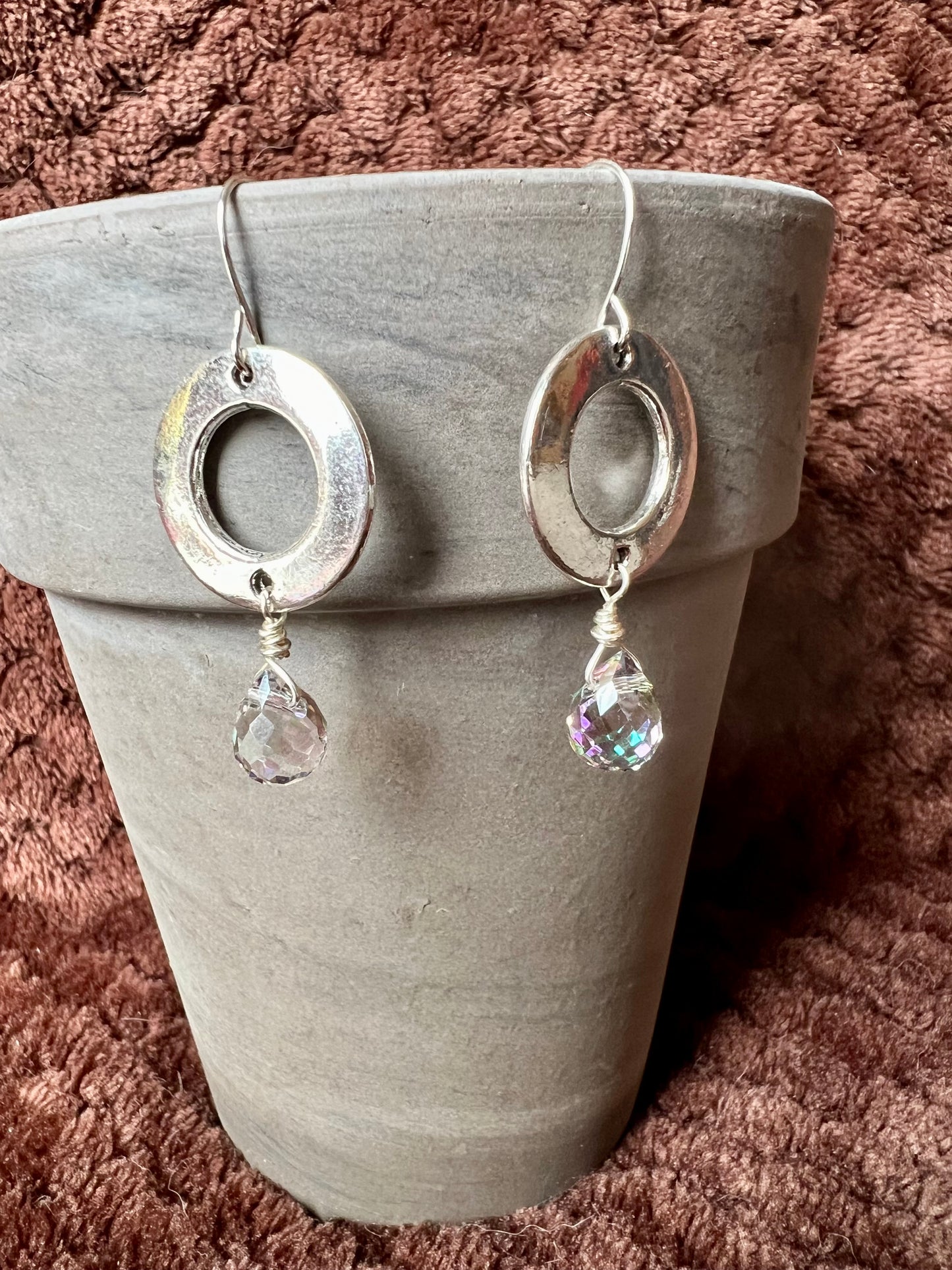 Earrings- Silver plated metal with antiqued silver plated washer shaped links and crystal clear briolettes with AB finish.