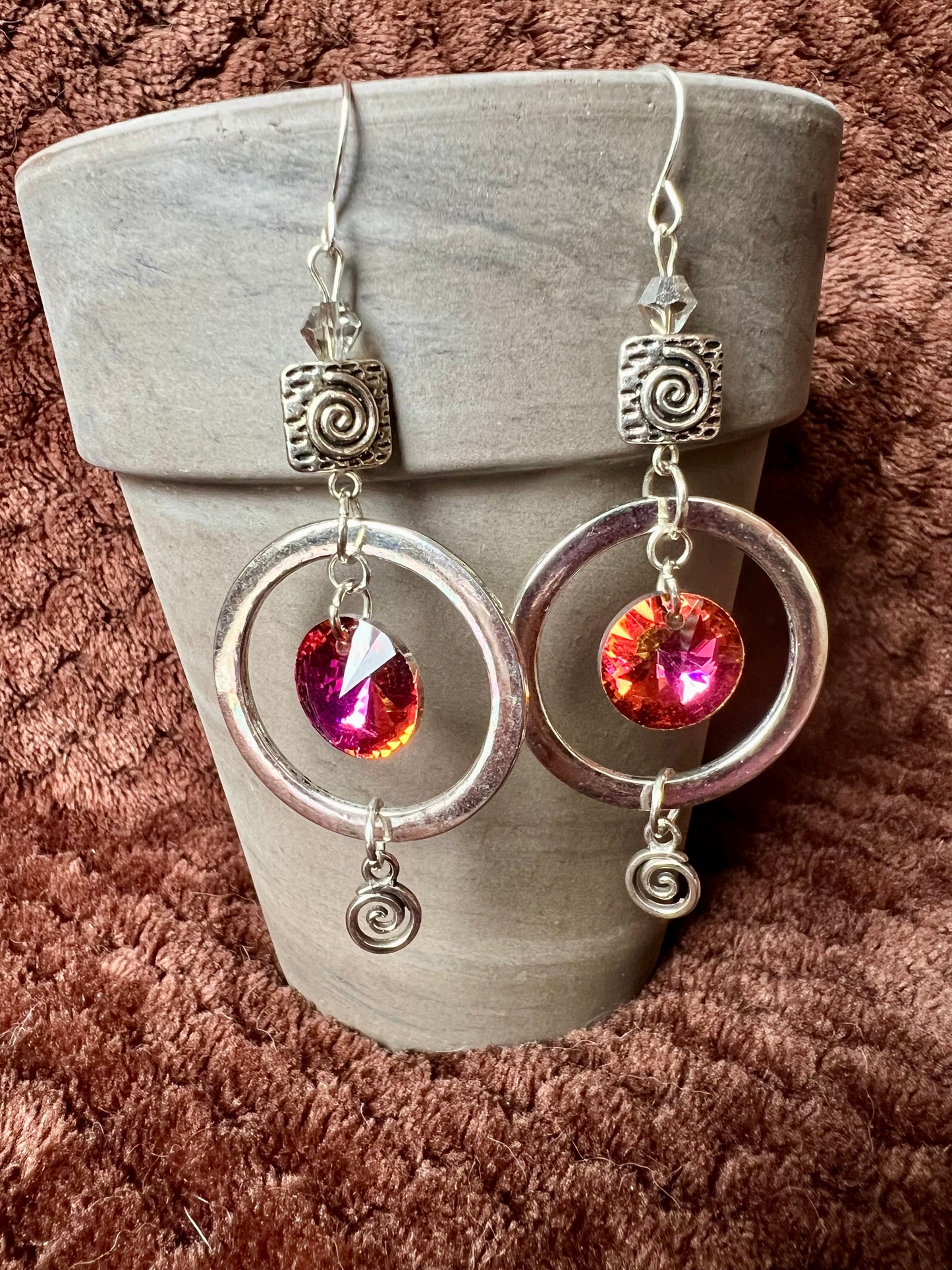 Earrings- Antiqued silver plated metal with silver coated clear crystal bicones and silver foiled iridescent pink/orange crystal beads.