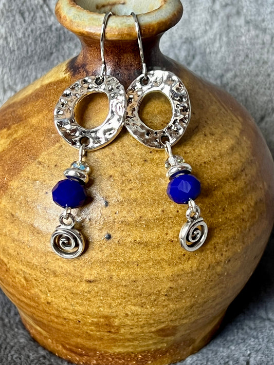 Earrings- Silver plated antiqued metal with small AB clear crystals and dark blue crystals.