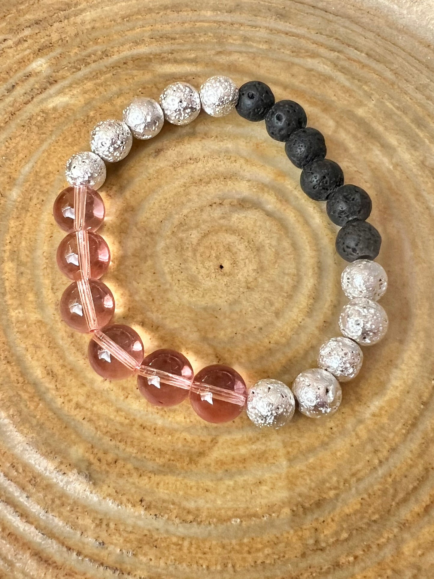 Bracelet- pink glass, silver coated lava beads, and black lava stone beads for essential oils.