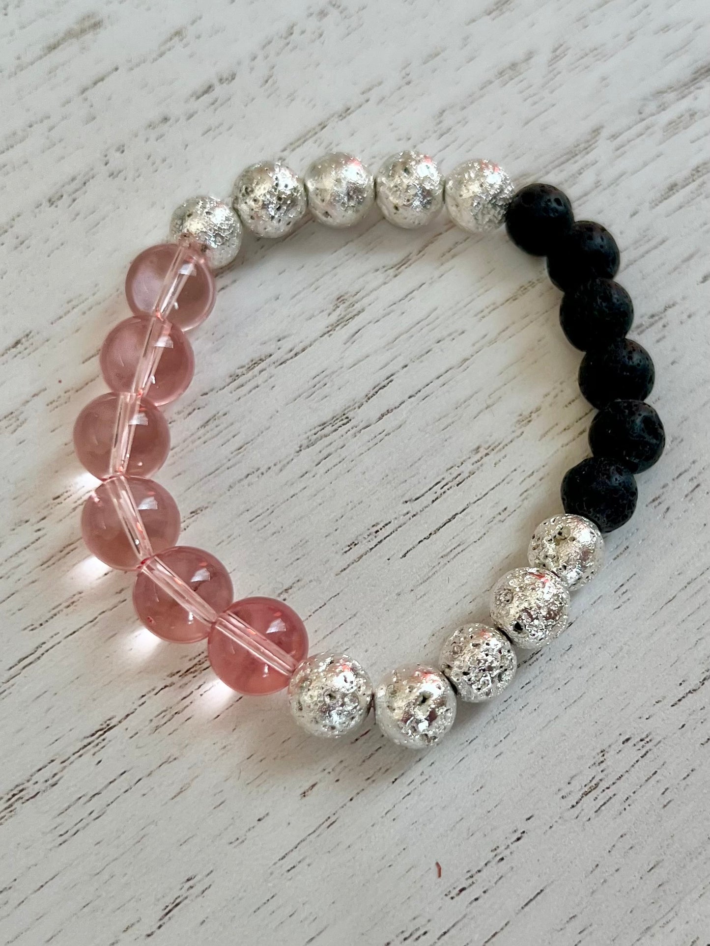 Bracelet- pink glass, silver coated lava beads, and black lava stone beads for essential oils.