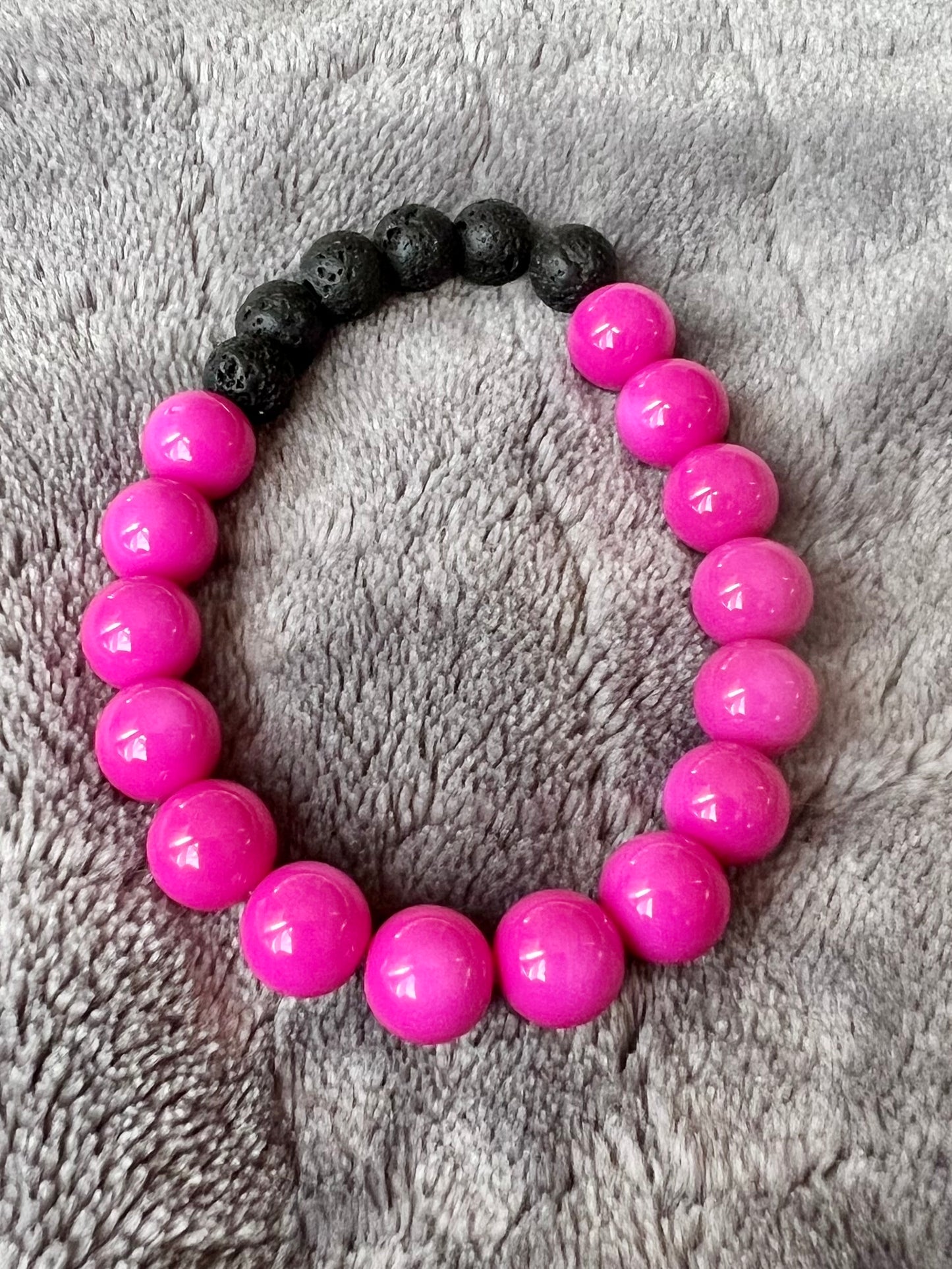 Bracelet- pink beads with black lava stone beads for essential oils.