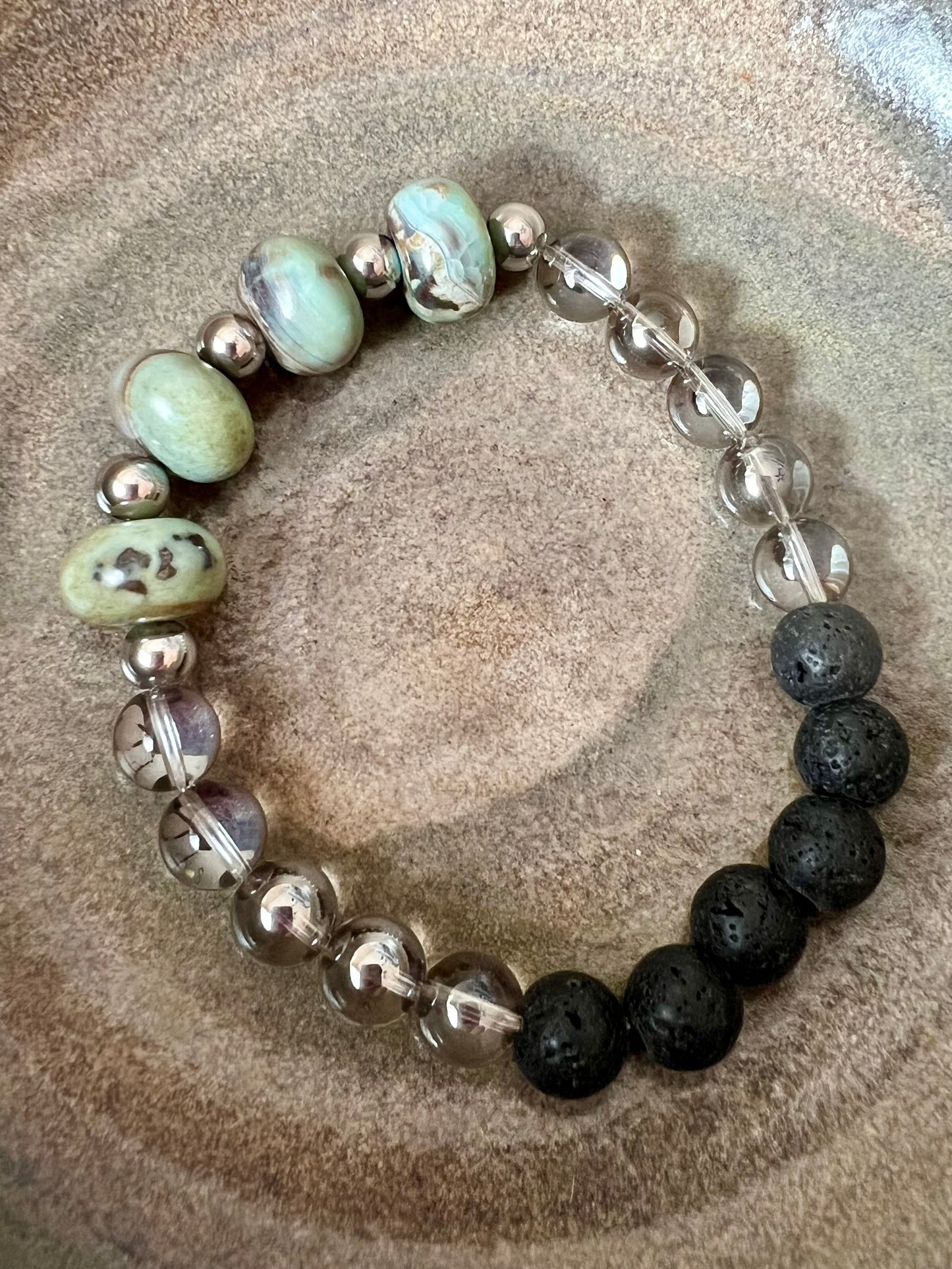 Bracelet- natural stone beads, stainless steel spacer beads, glass beads, and black lava beads for essential oils.