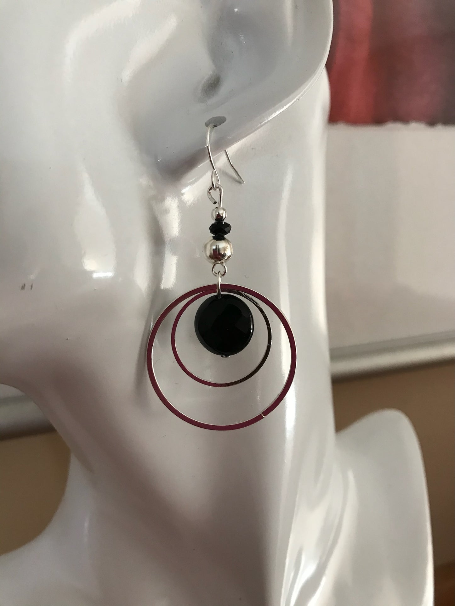 Earrings- Silver plated metal hoops with onyx coin beads.