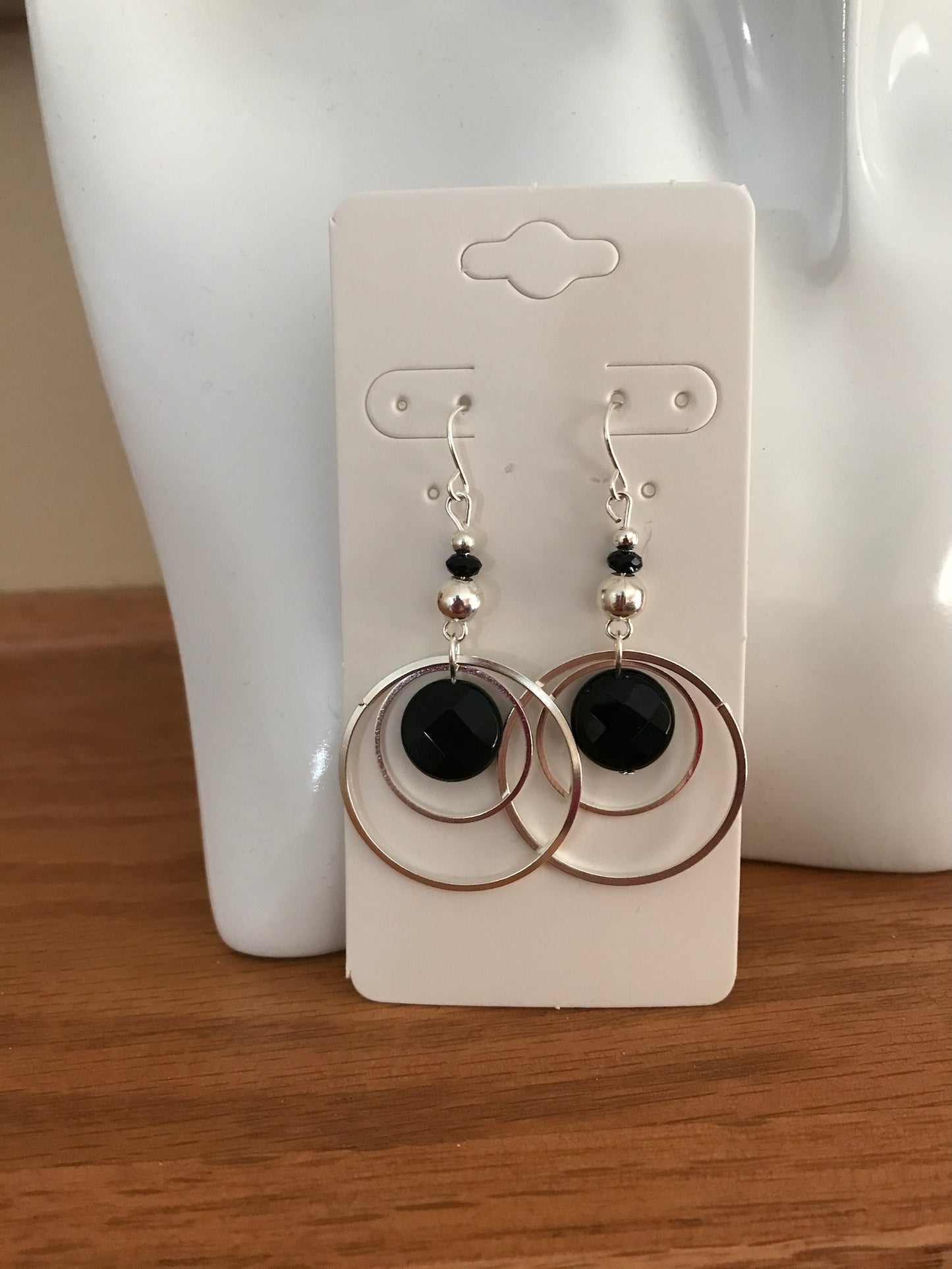 Earrings- Silver plated metal hoops with onyx coin beads.