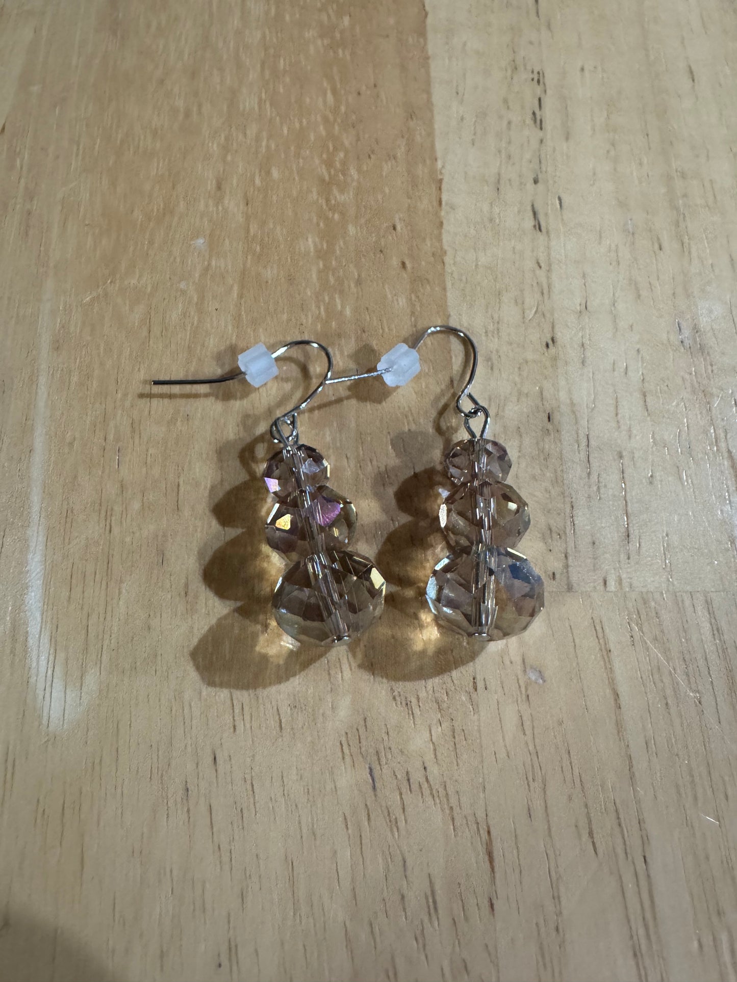 Earrings- Stainless steel ear hooks, silver plated metal with opaque black crystals.