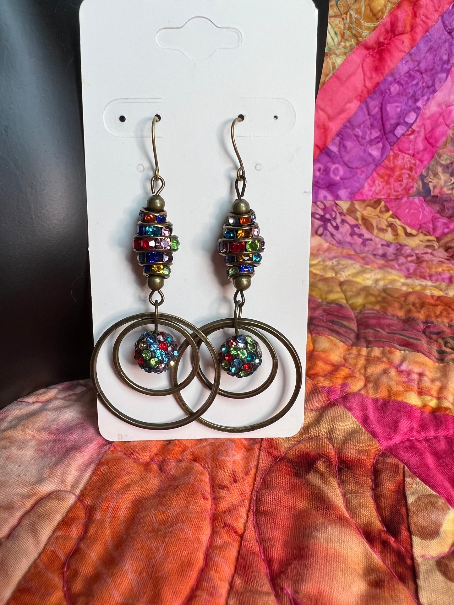 Earrings- Antique gold plated metal with multi colored crystals.