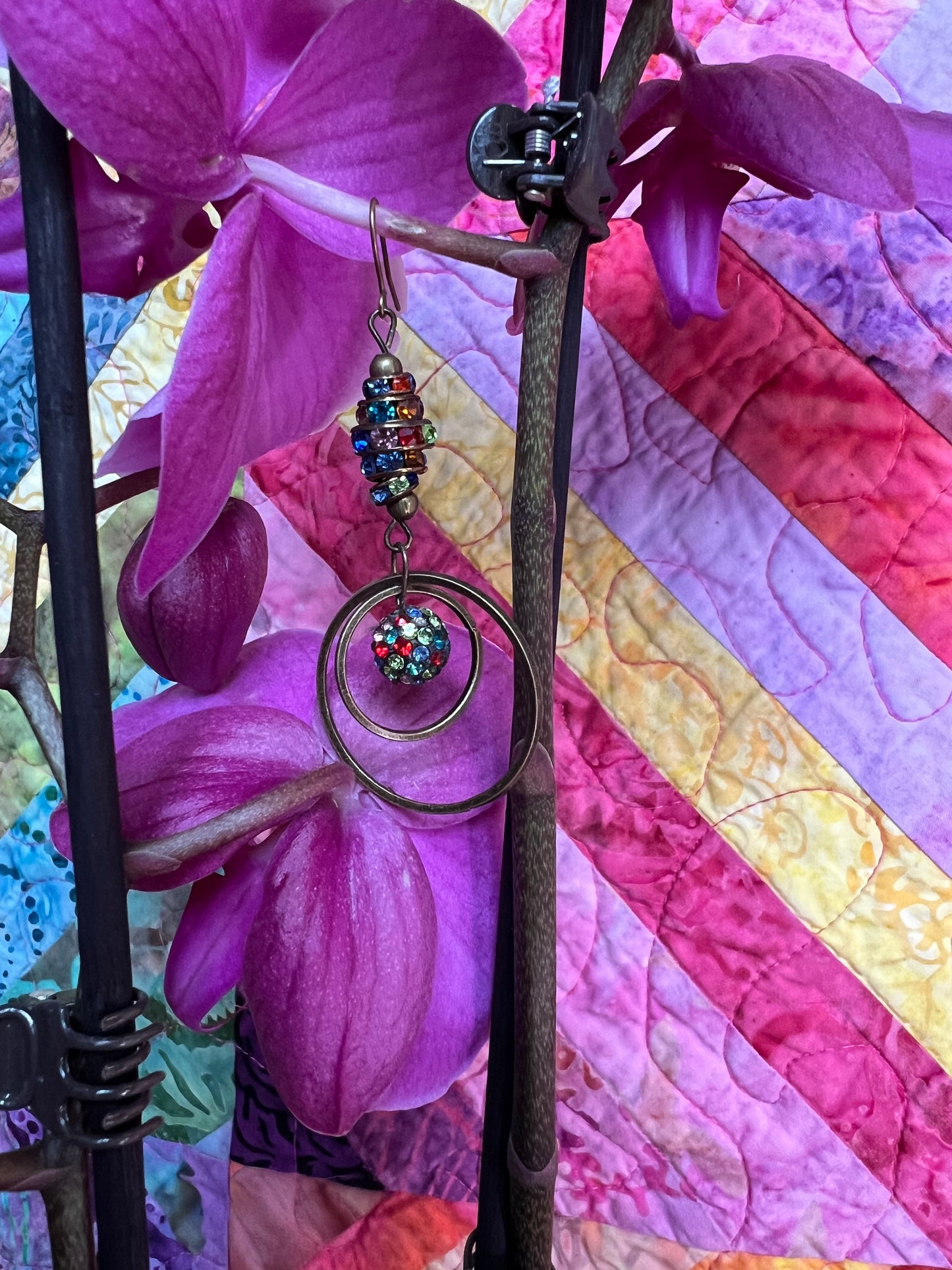 Earrings- Antique gold plated metal with multi colored crystals.