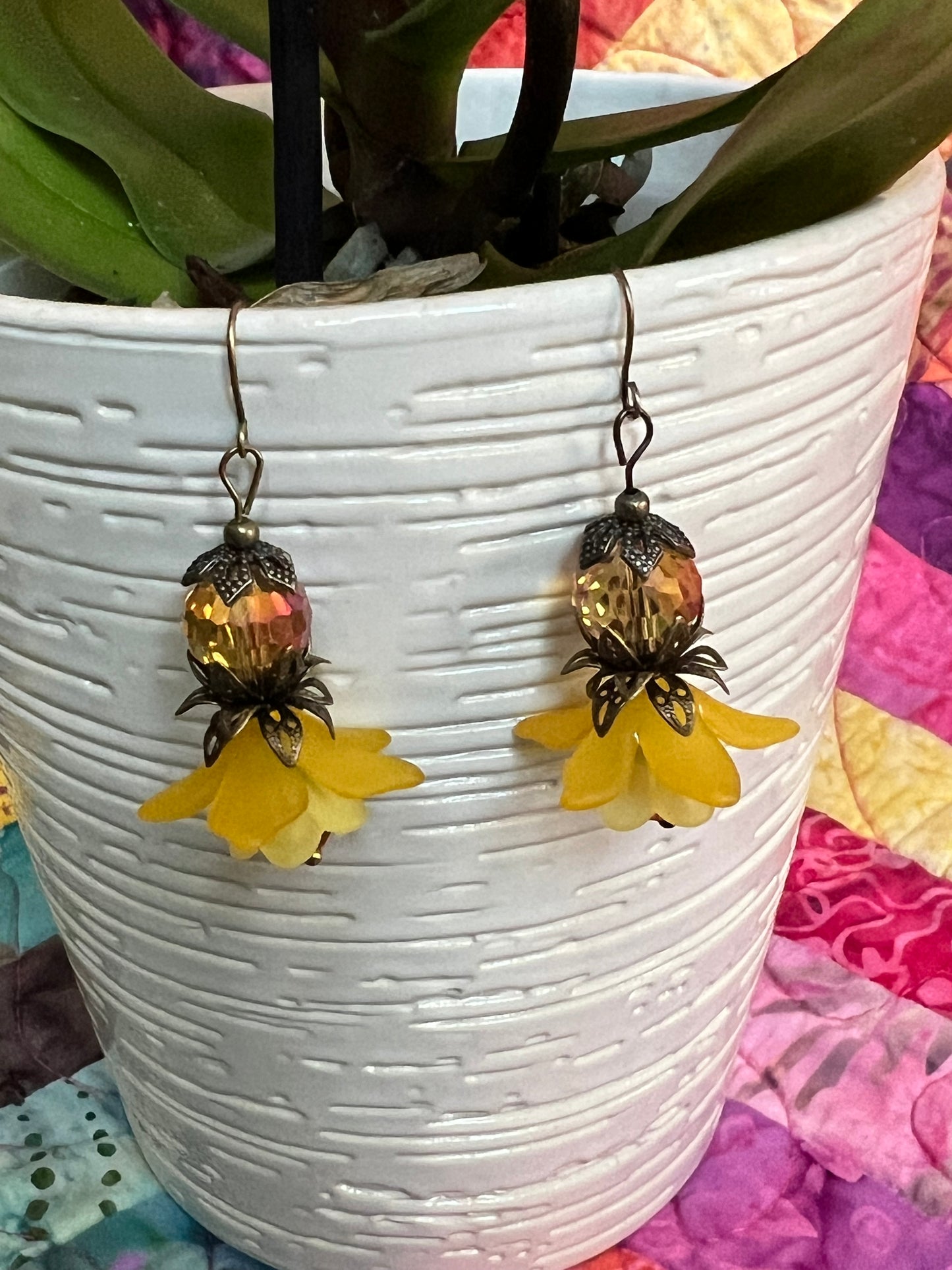 Earrings- Antique gold plated metal with acrylic yellow flower beads and crystal beads.