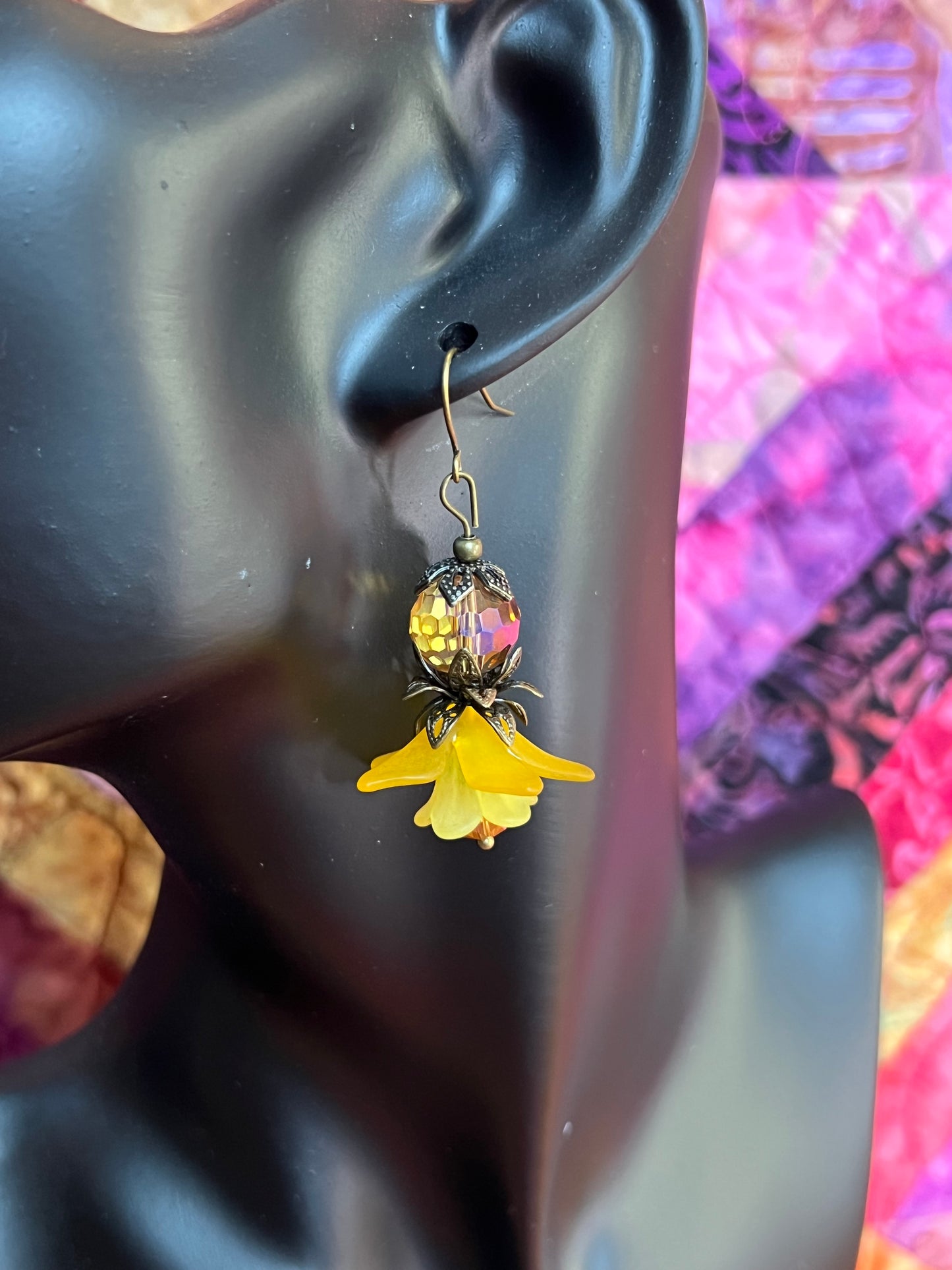 Earrings- Antique gold plated metal with acrylic yellow flower beads and crystal beads.