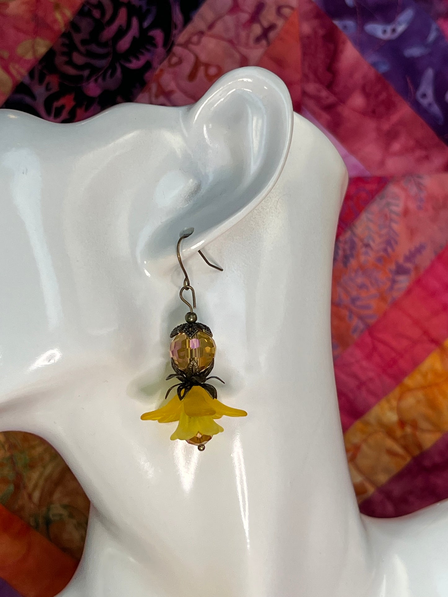 Earrings- Antique gold plated metal with acrylic yellow flower beads and crystal beads.