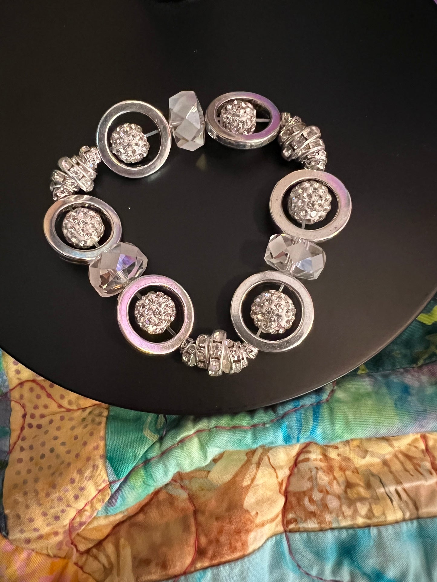 Bracelet- Silver plated metal, clear rondelles, rhinestones, and crystals.