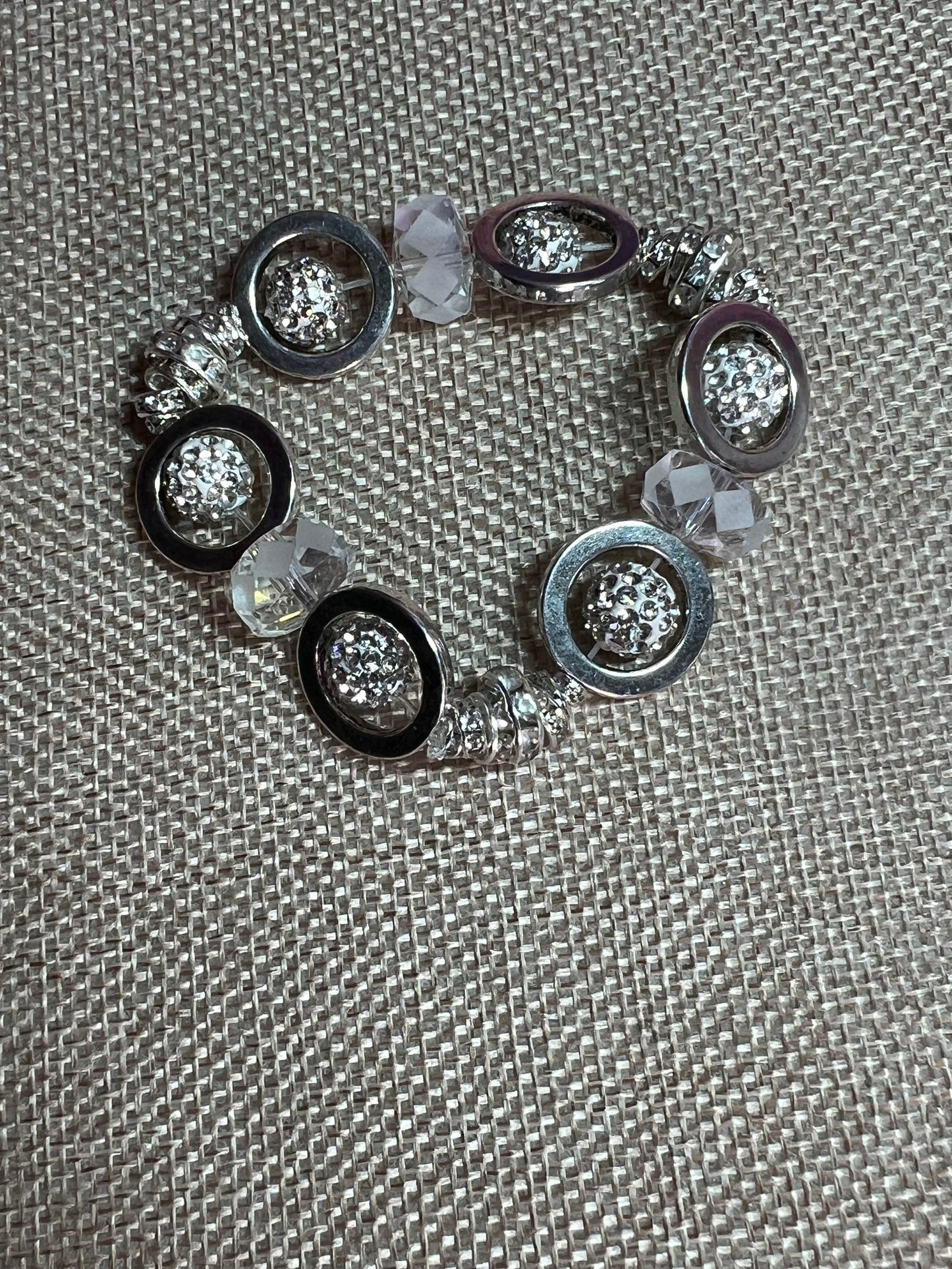 Bracelet- Silver plated metal, clear rondelles, rhinestones, and crystals.