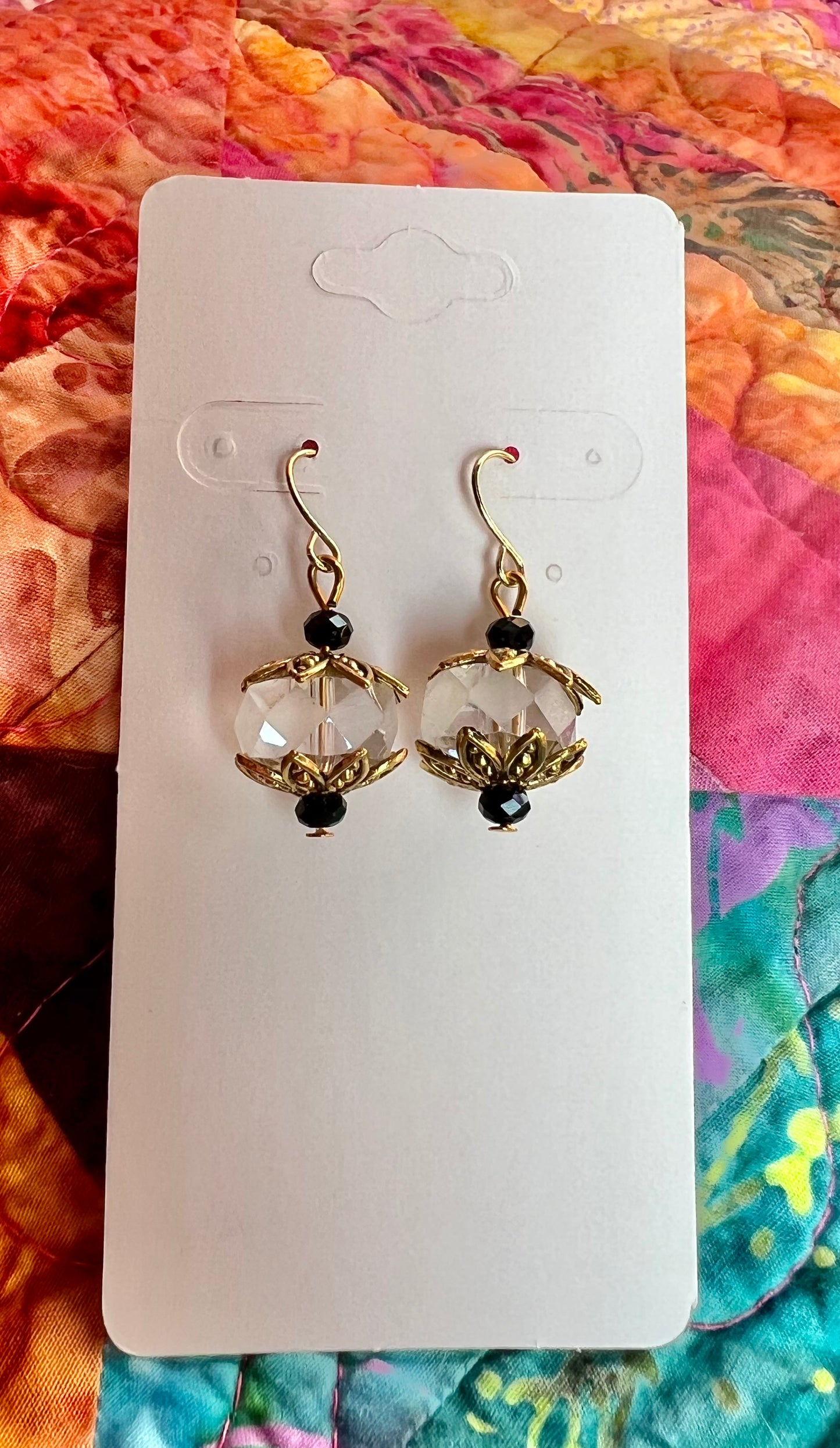 Earrings- Gold plated metal with black and clear crystals.