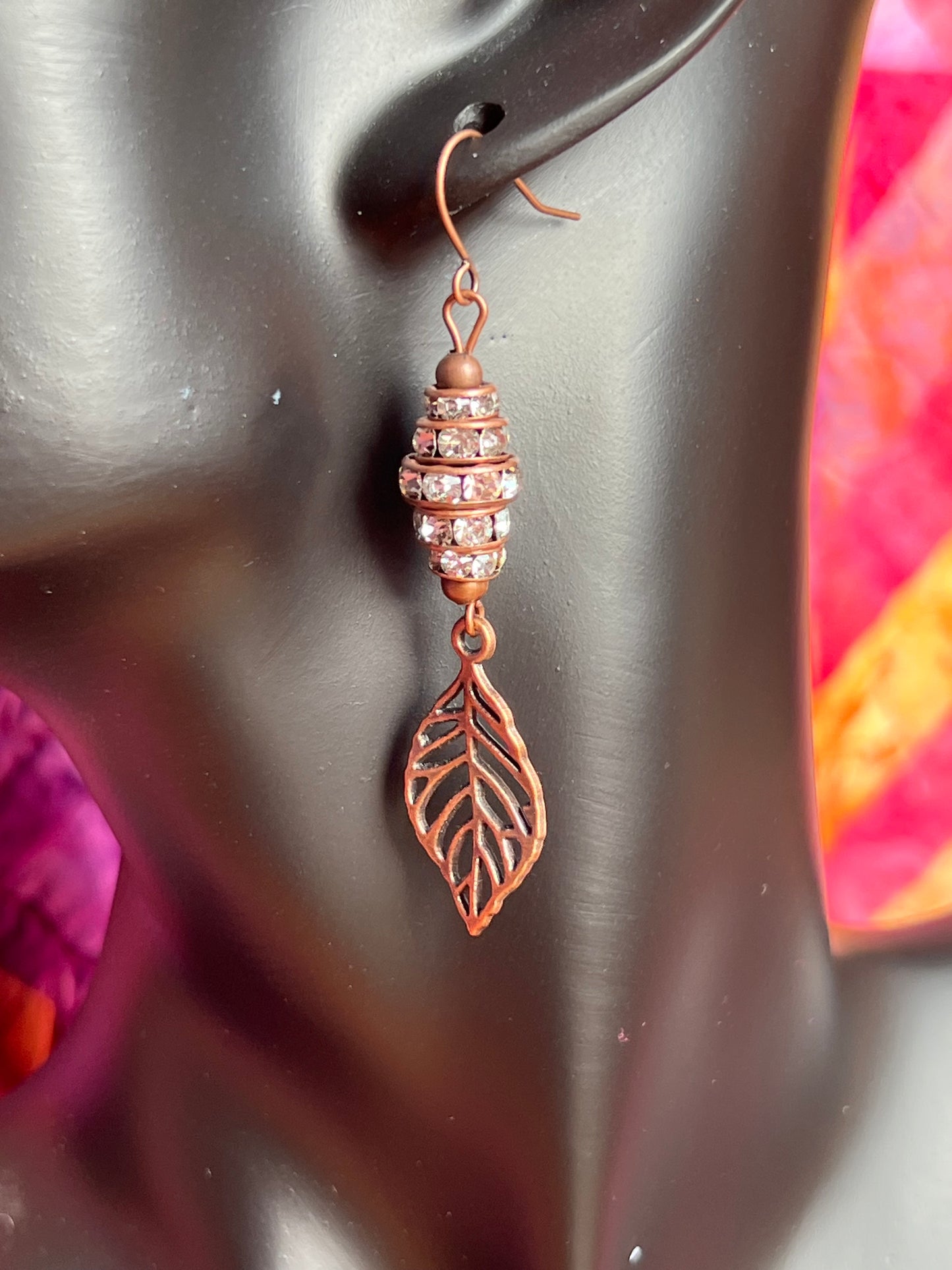 Earrings- Antique copper plated metal leaves with clear crystal rondelles.