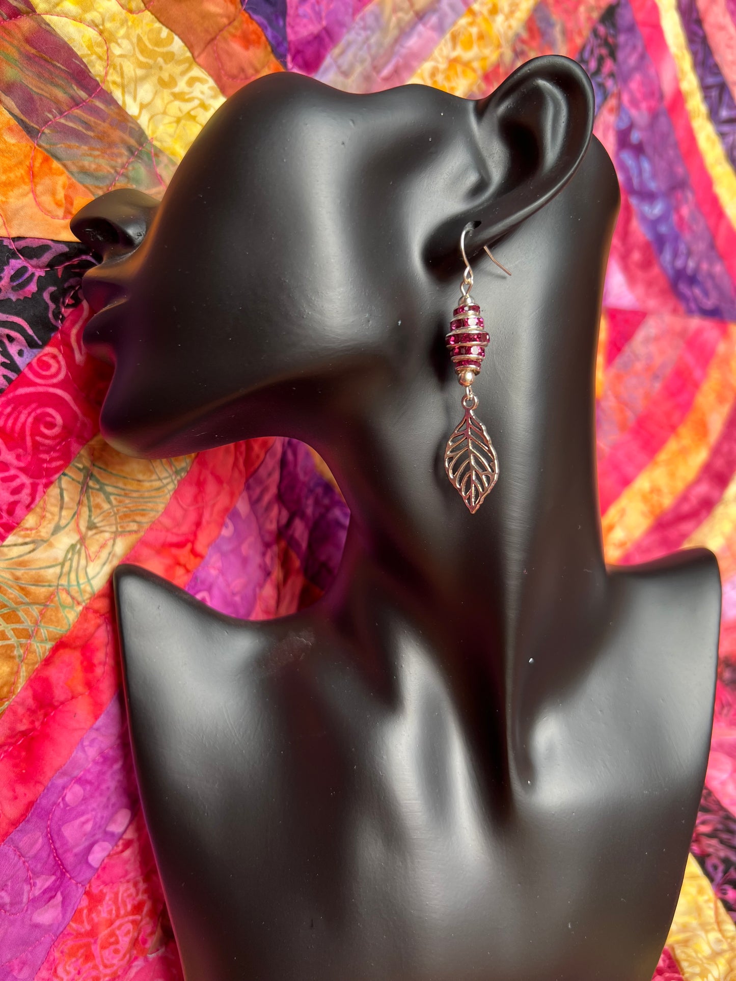 Earrings- Silver plated metal leaves with fuchsia colored crystal rondelles.