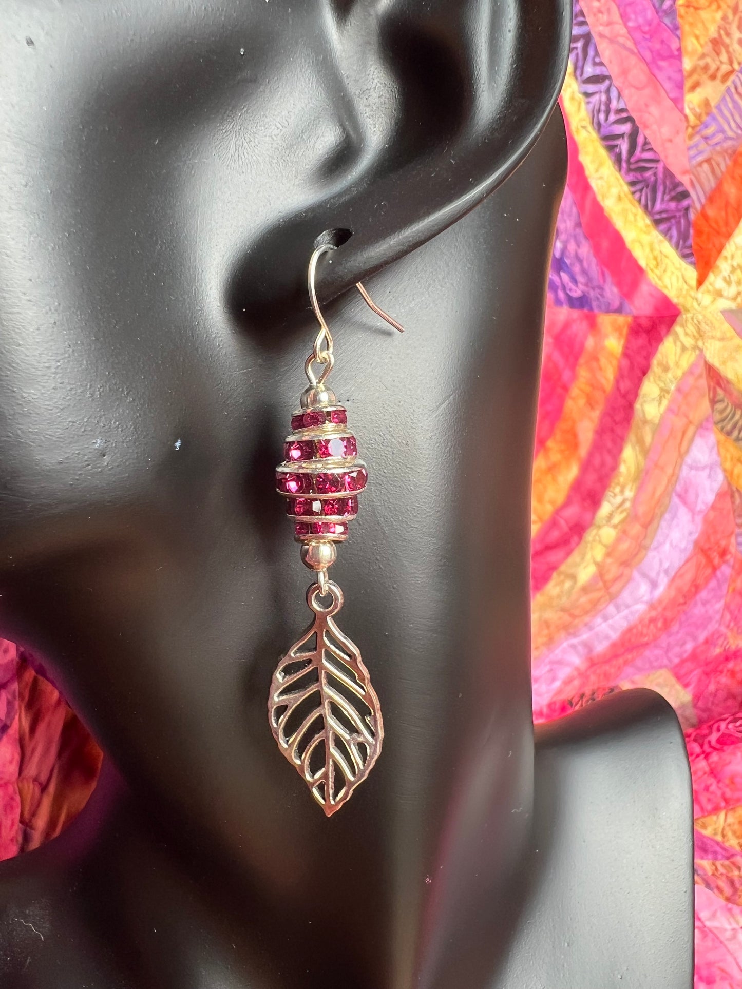 Earrings- Silver plated metal leaves with fuchsia colored crystal rondelles.