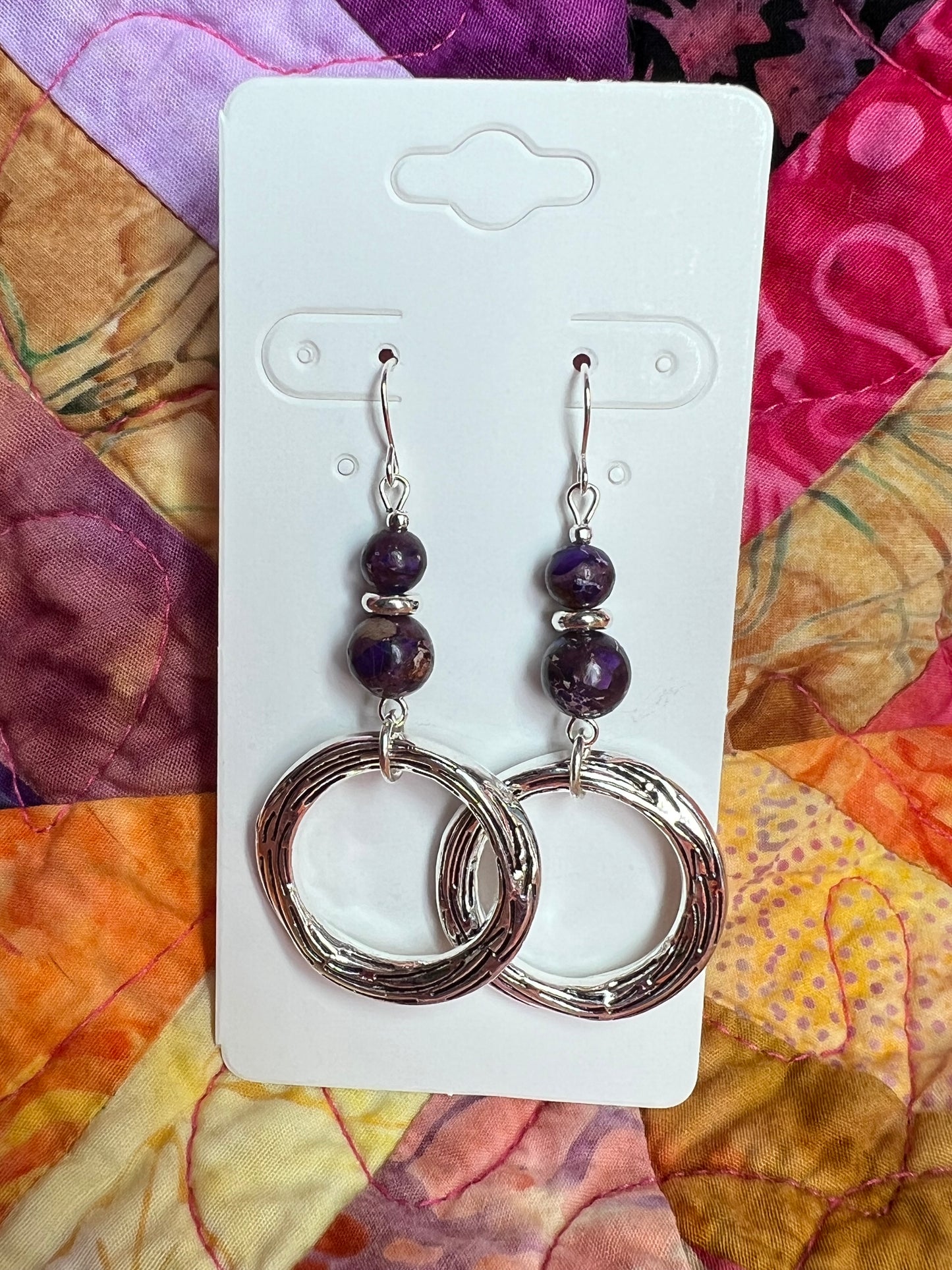 Earrings- Silver plated metal with purple dyed natural stone beads.