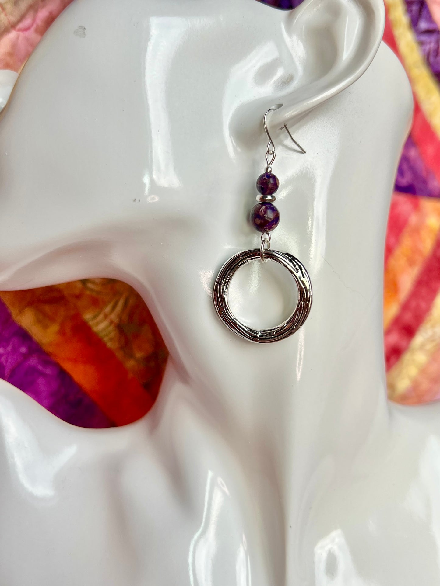 Earrings- Silver plated metal with purple dyed natural stone beads.