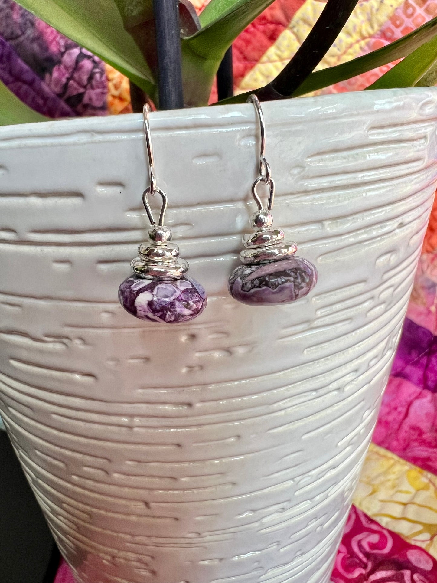 Earrings- Silver plated metal with purple dyed stone.