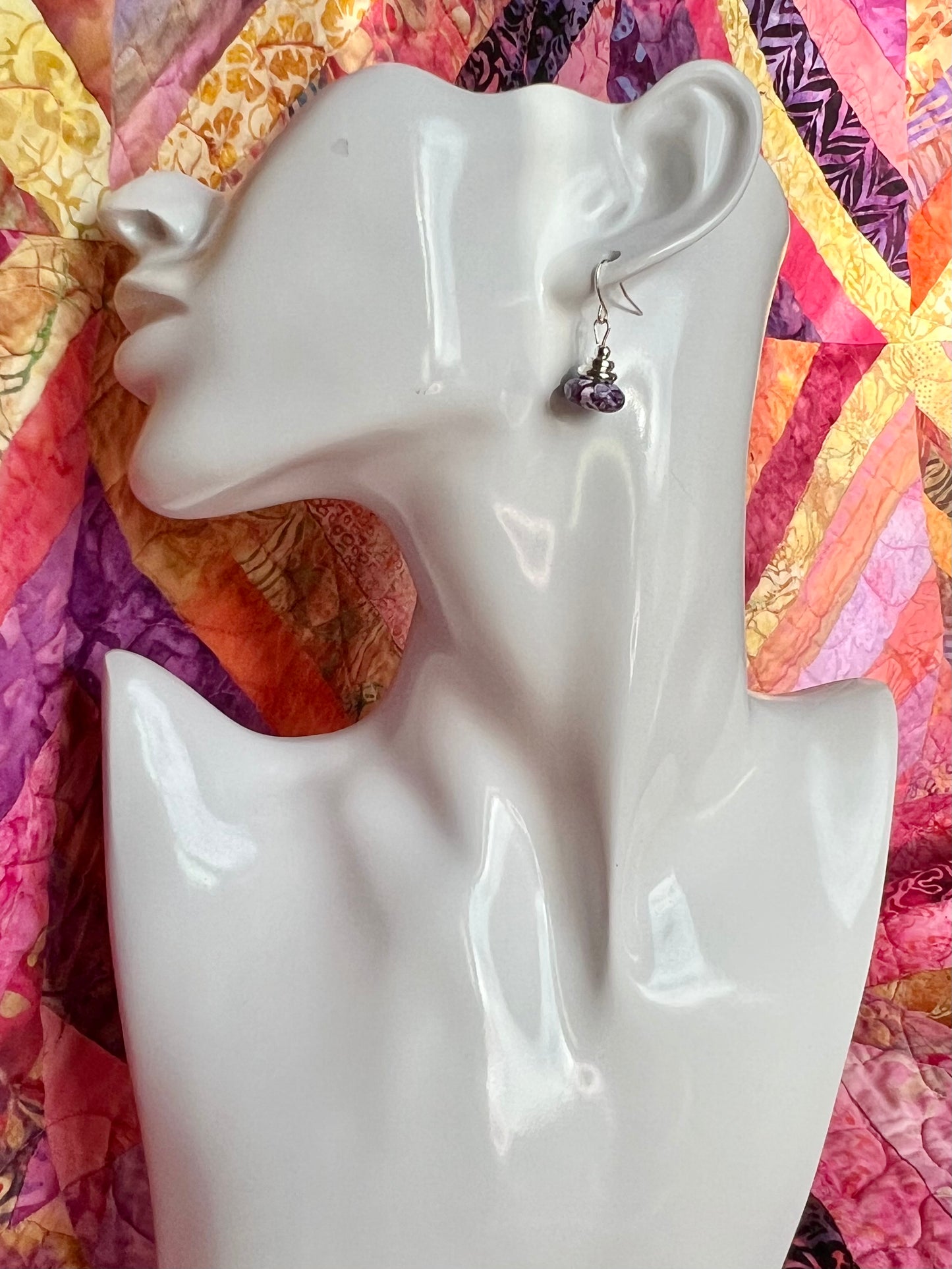 Earrings- Silver plated metal with purple dyed stone.