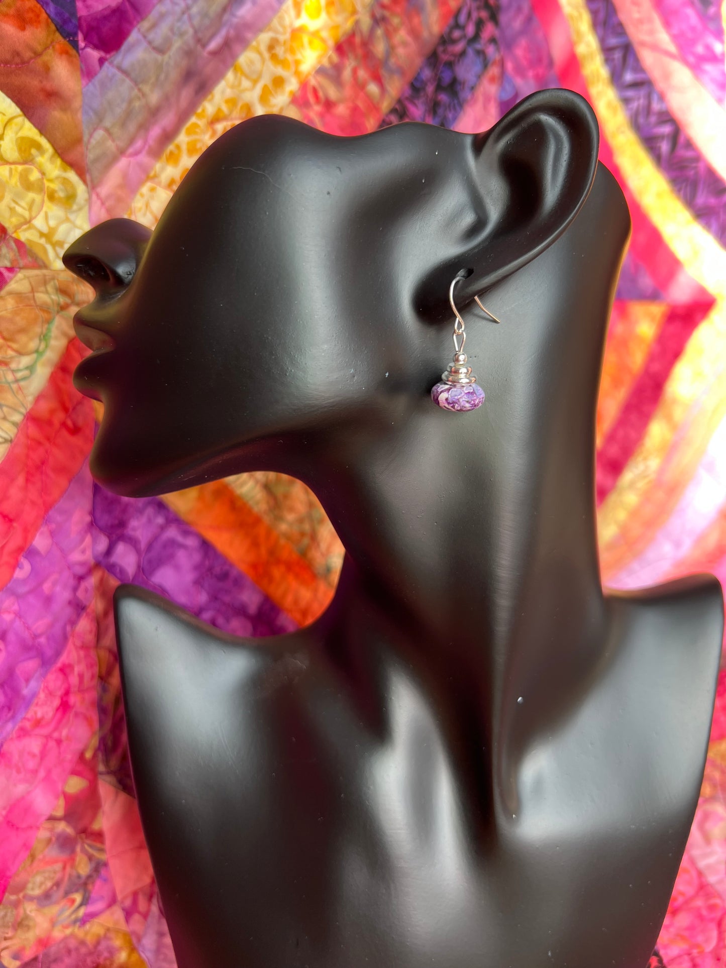 Earrings- Silver plated metal with purple dyed stone.