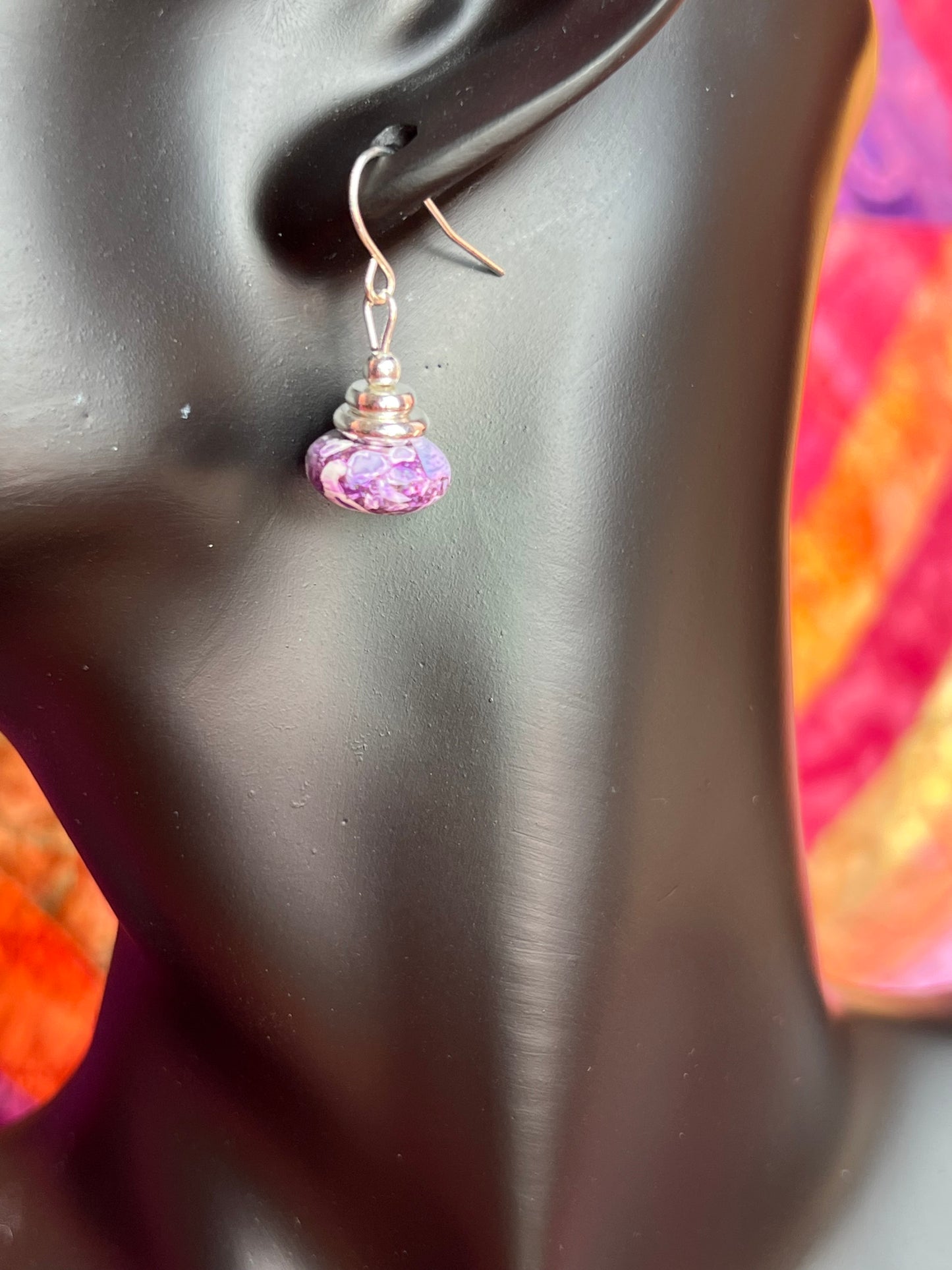 Earrings- Silver plated metal with purple dyed stone.