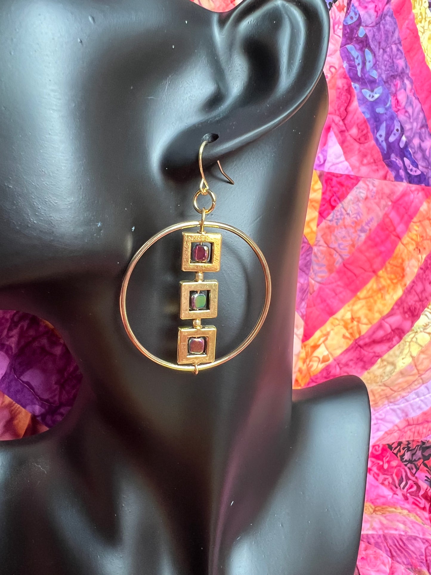 Earrings- Gold plated metal hoops with squares and metallic rainbow hematite cube seed beads.