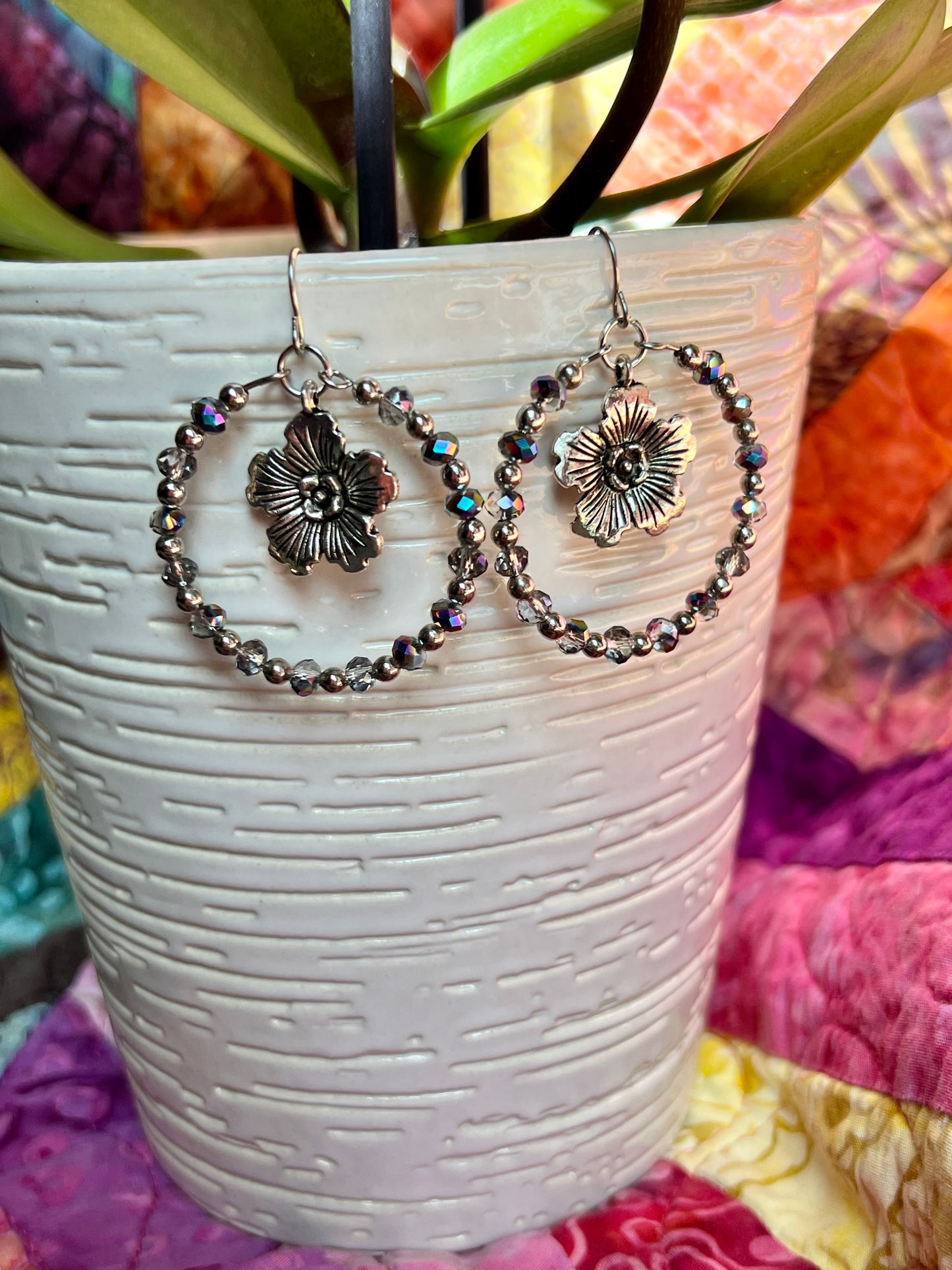 Earrings- Silver plated metal with metallic rainbow coated crystal beads.