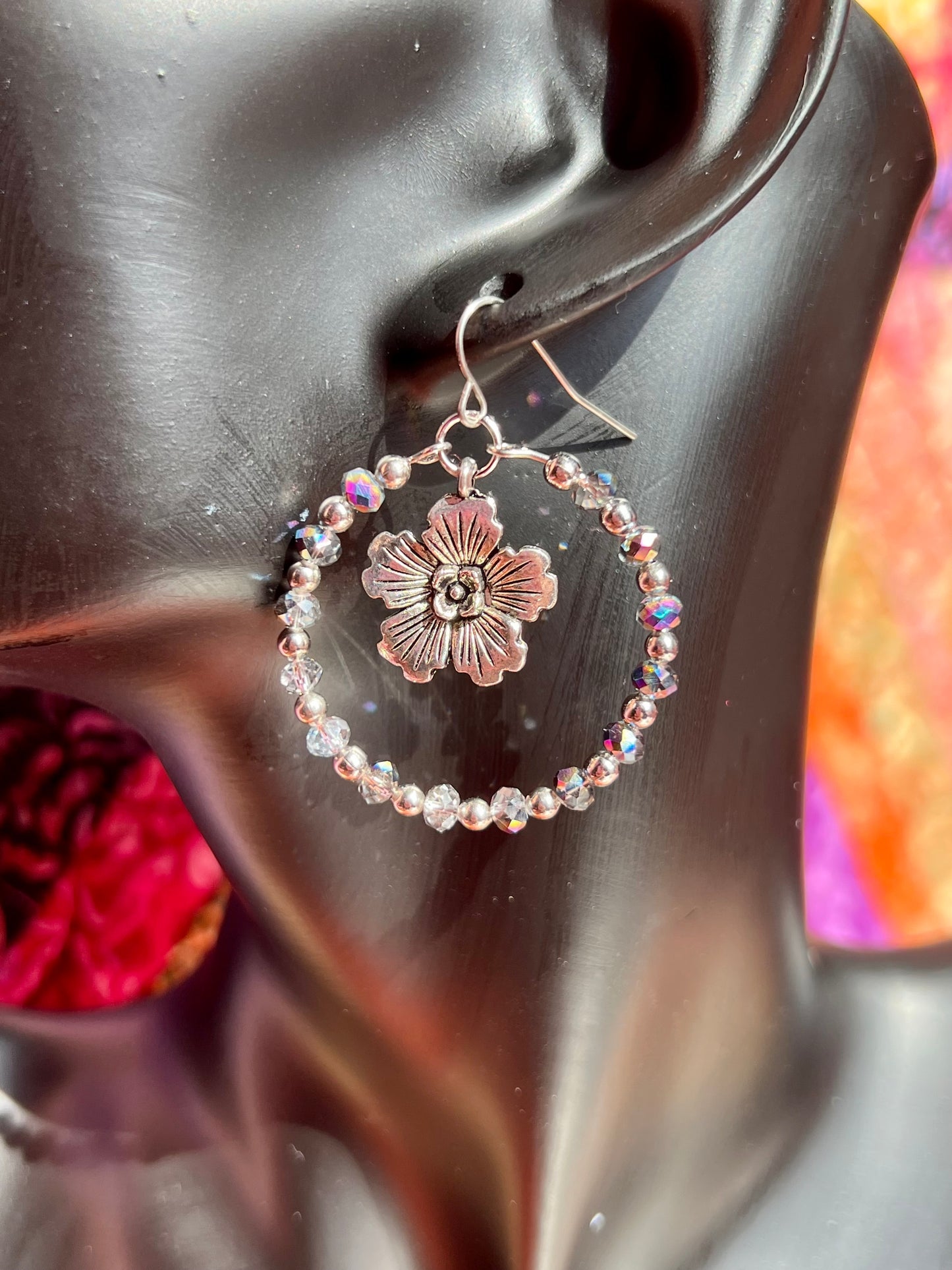 Earrings- Silver plated metal with metallic rainbow coated crystal beads.