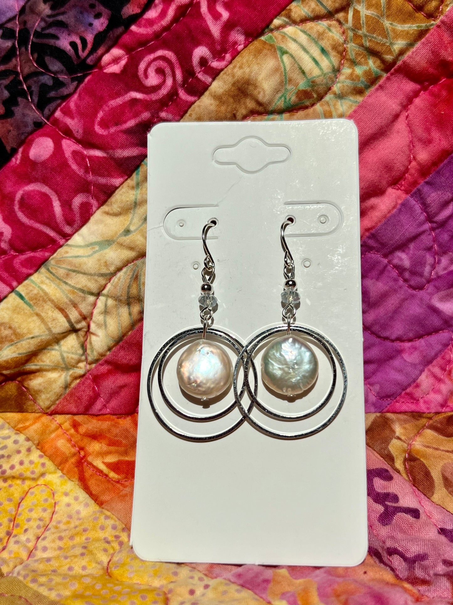 Earrings- Cat shadowing silver plated metal with genuine freshwater coin pearls and small crystals.