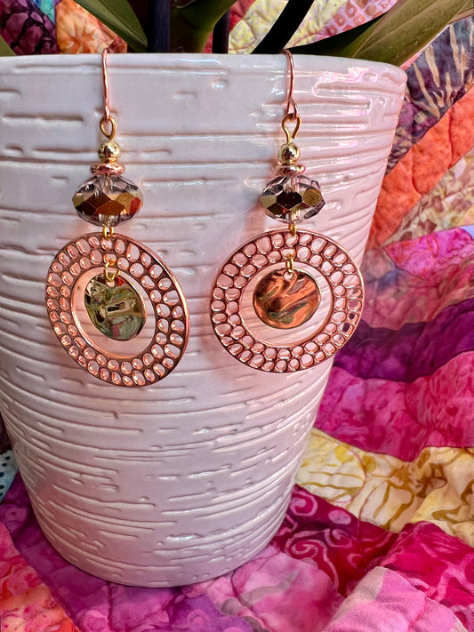 Earrings- Copper and gold plated metal and a clear crystal with a gold stripe in the center.