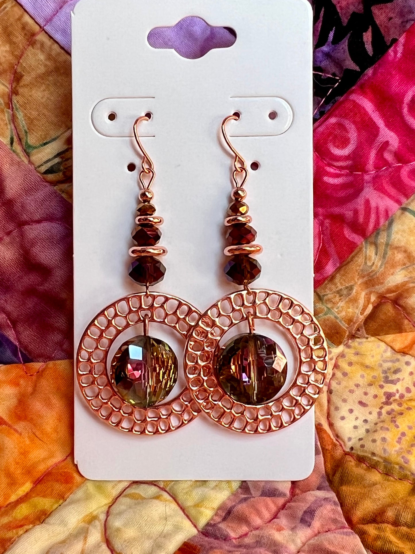 Earrings- Rose gold plated metal with crystal beads.