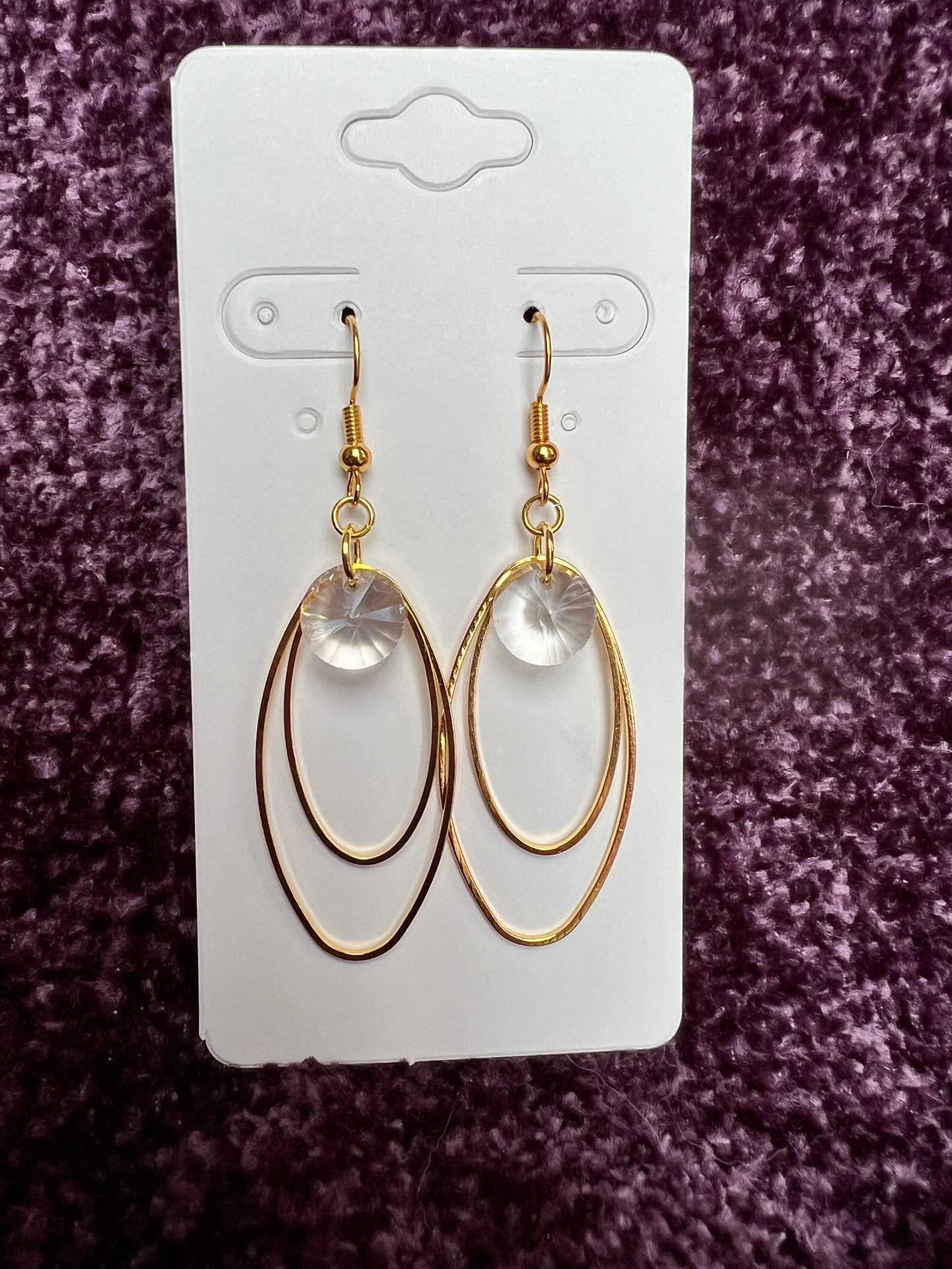 Earrings- Gold plated metal with clear crystal beads.