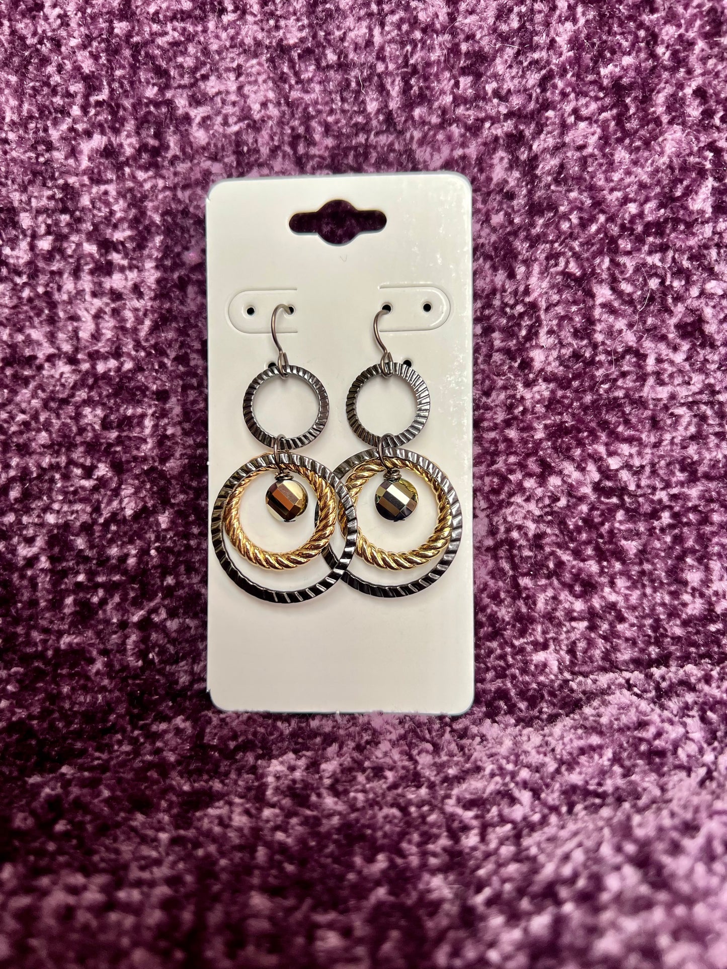 Earrings- Titanium ear hooks with gunmetal and gold plated metal hoops with unique crystals.