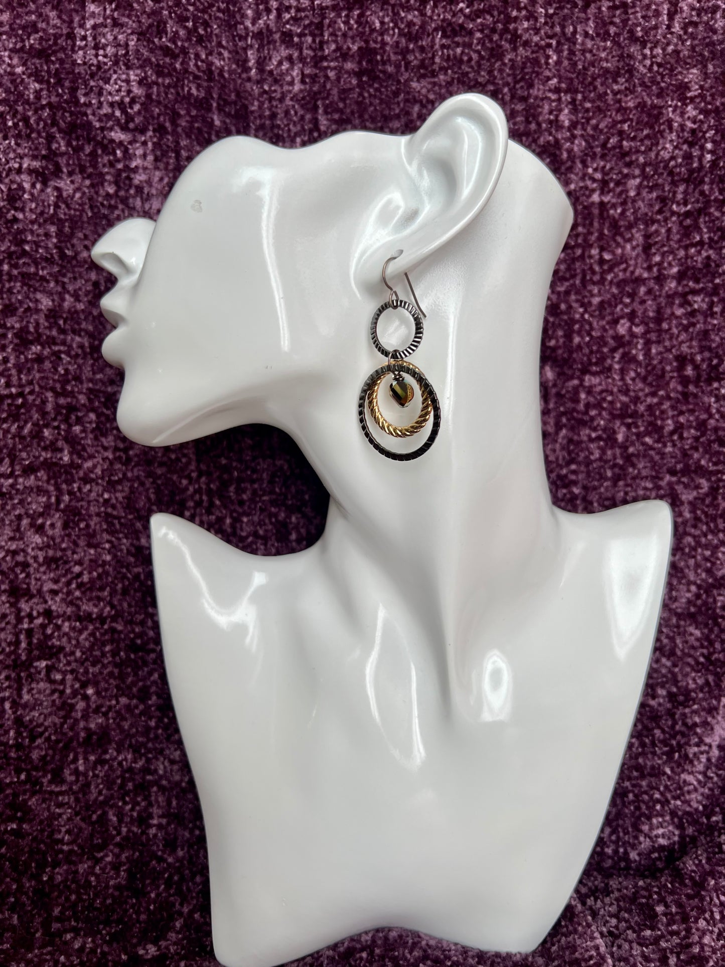 Earrings- Titanium ear hooks with gunmetal and gold plated metal hoops with unique crystals.