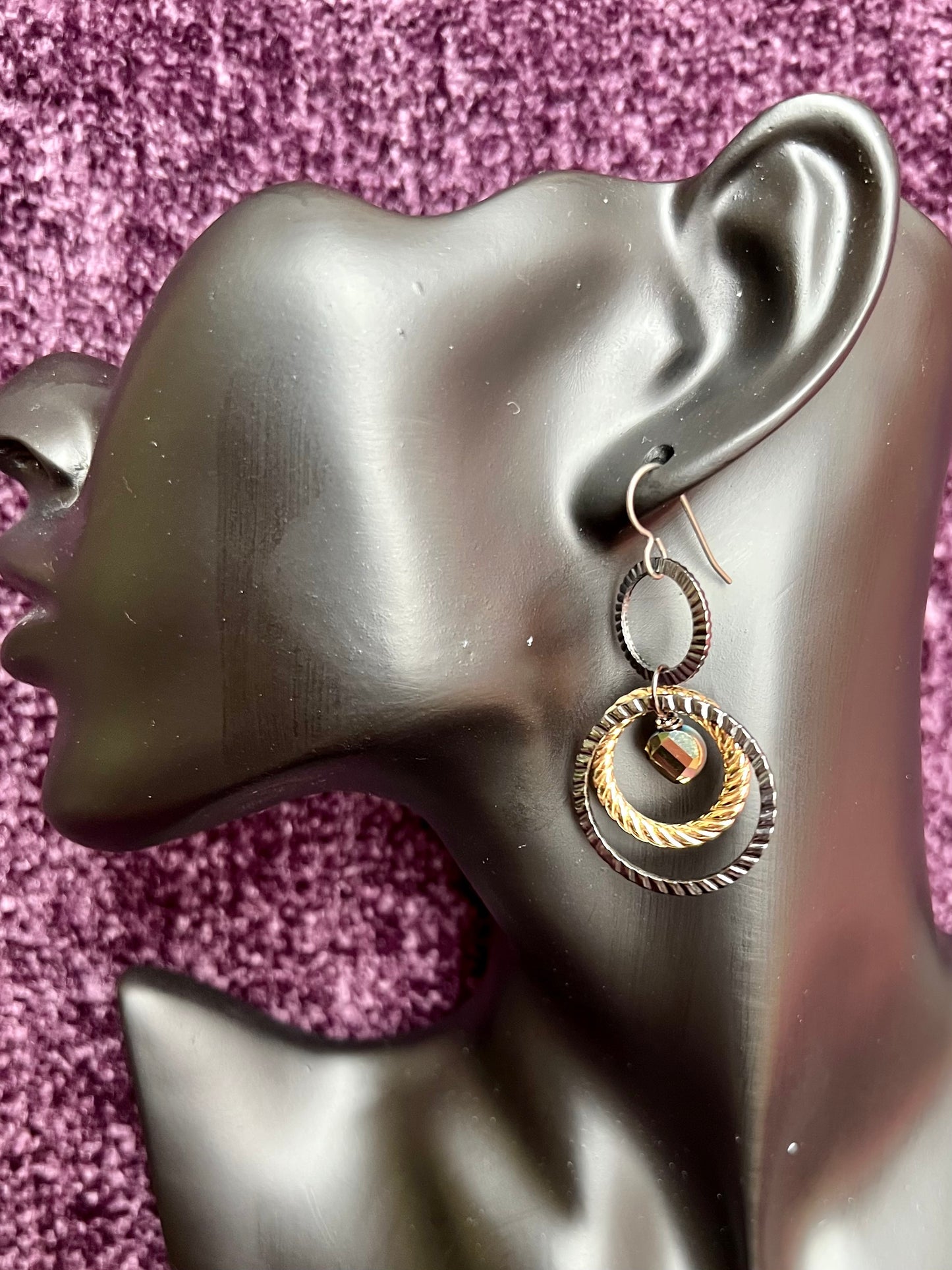 Earrings- Titanium ear hooks with gunmetal and gold plated metal hoops with unique crystals.