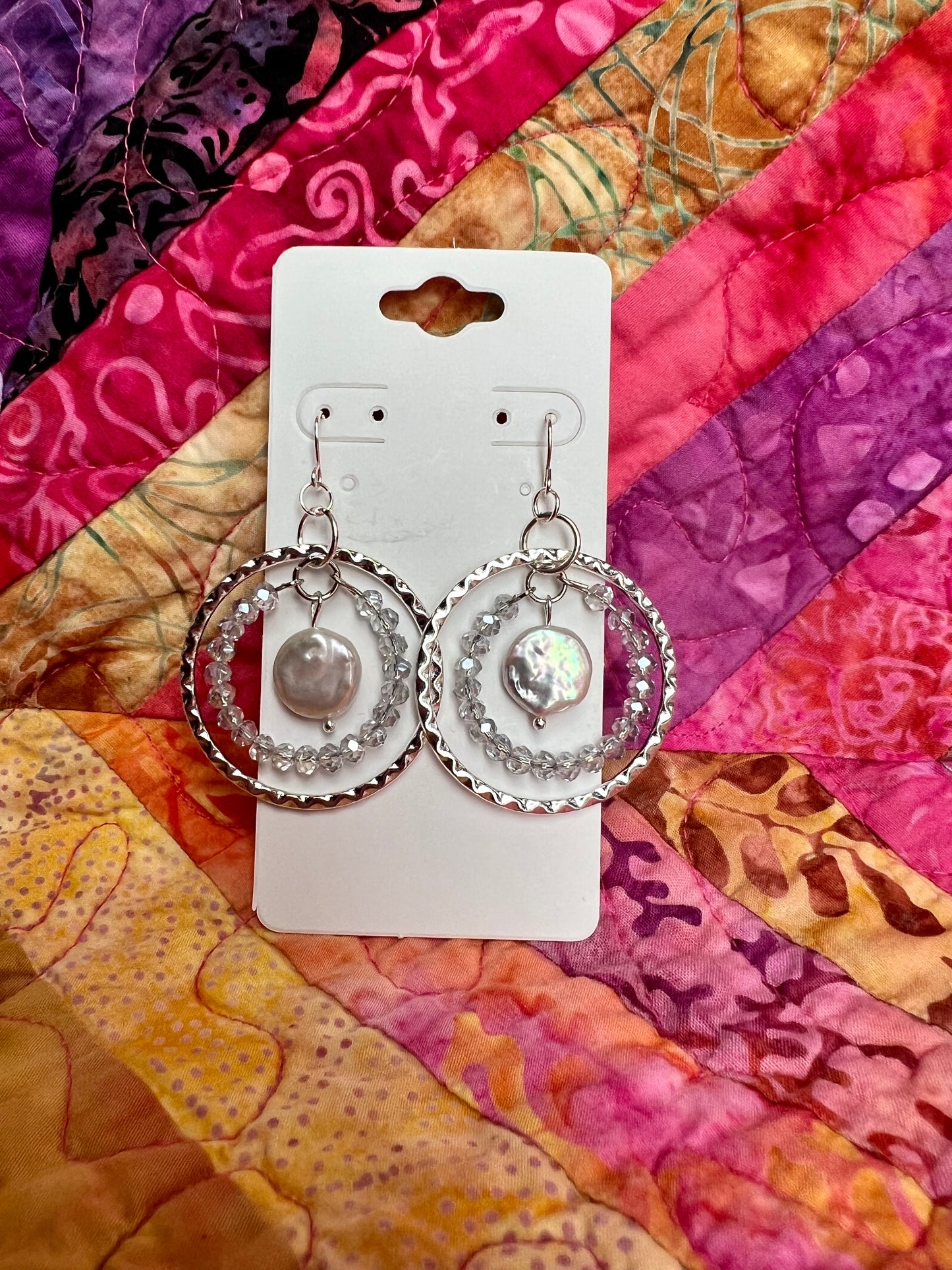 Earrings- Silver plated metal with silvery crystals and white freshwater coin pearls.