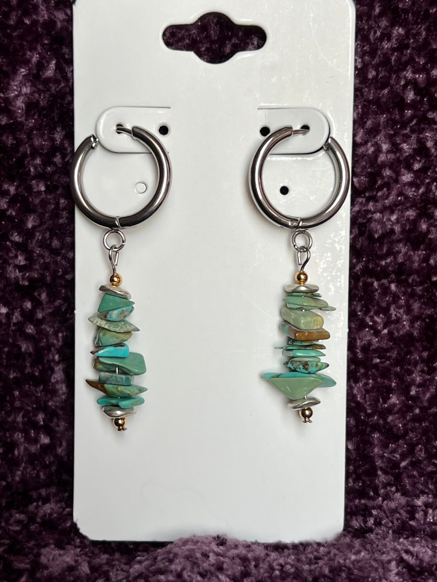 Earrings- Stainless steel huggie earrings with gold and silver plated metal and turquoise chips.