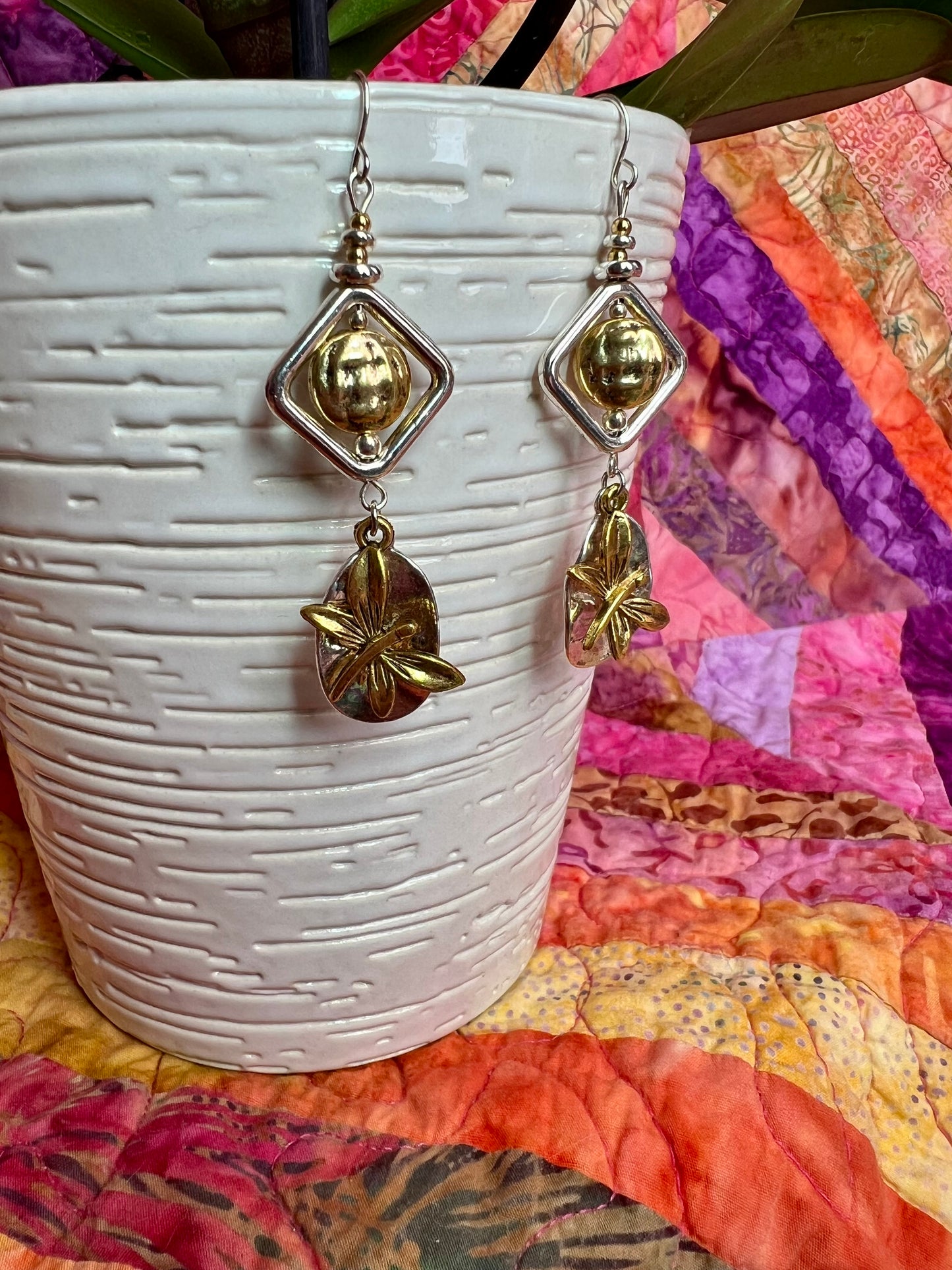 Earrings- Silver and gold plated metal with butterfly charms.