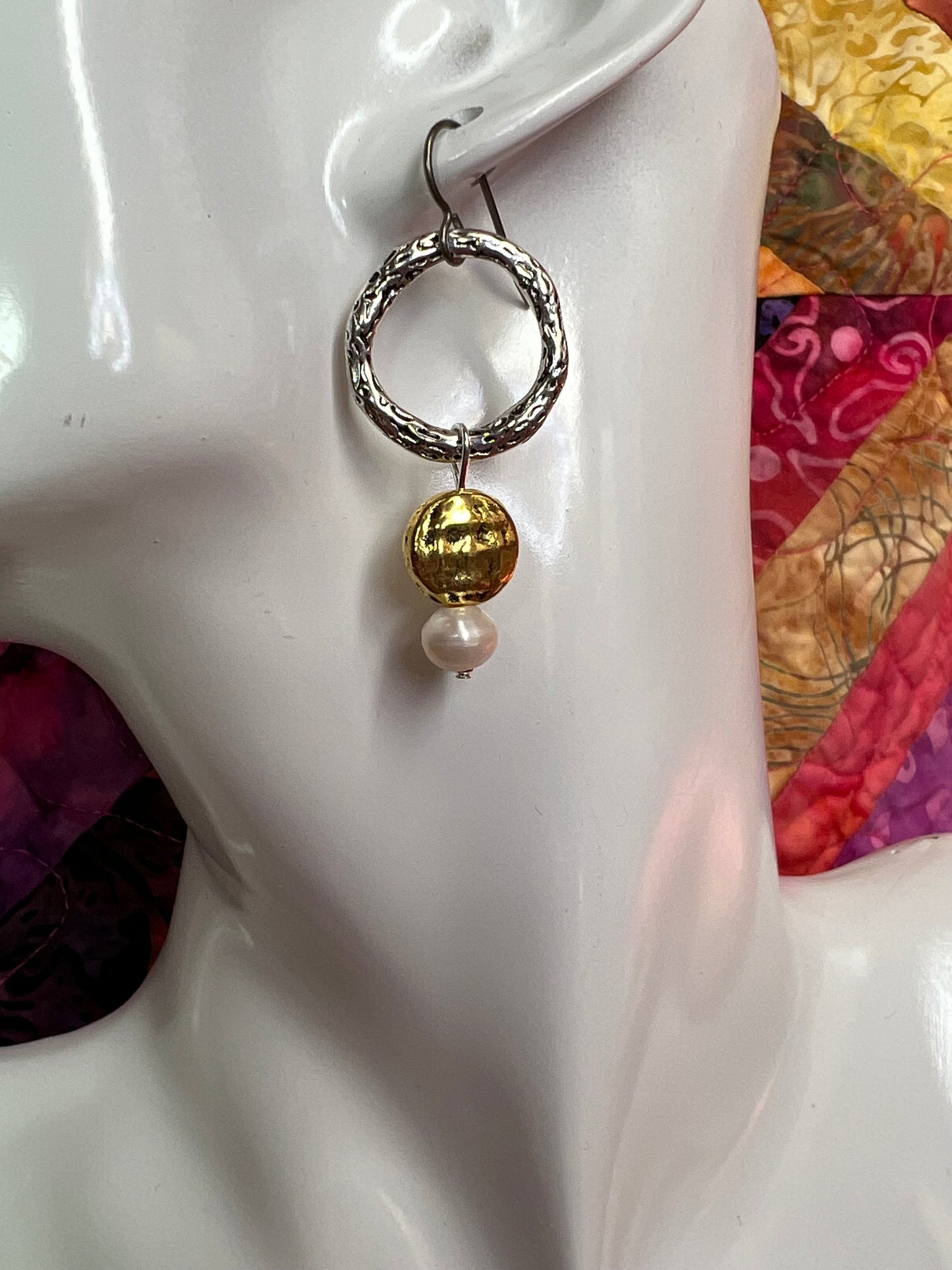 Earrings- Titanium ear hooks, silver and gold plated metal with genuine white freshwater pearls. Asymmetrical.