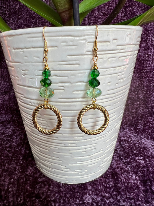 Earrings- Gold plated stainless steel ear hooks, gold plated metal with various green colored crystals.